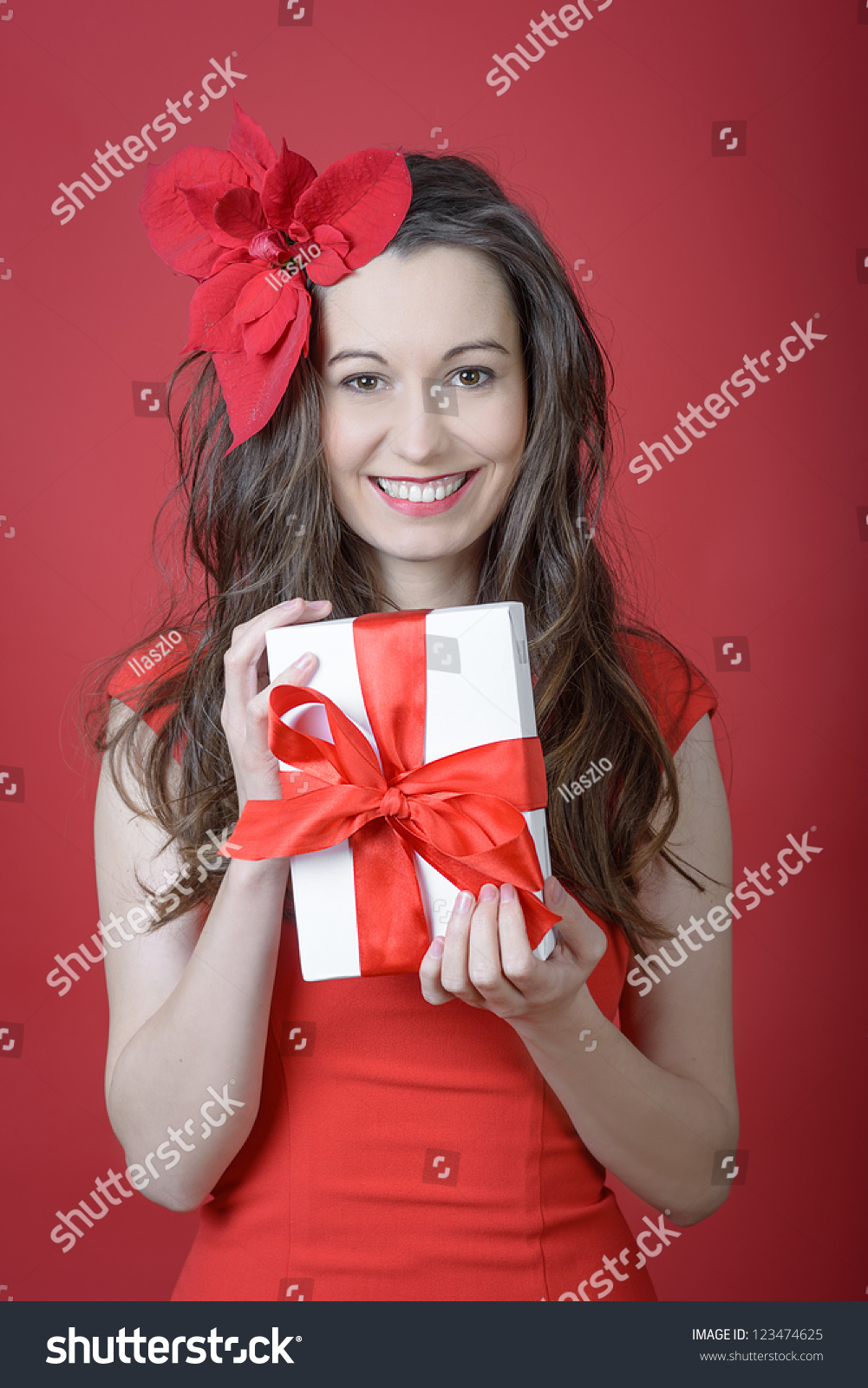 A Woman Holding A Gift Box In A Gesture Of Giving. Stock Photo ...