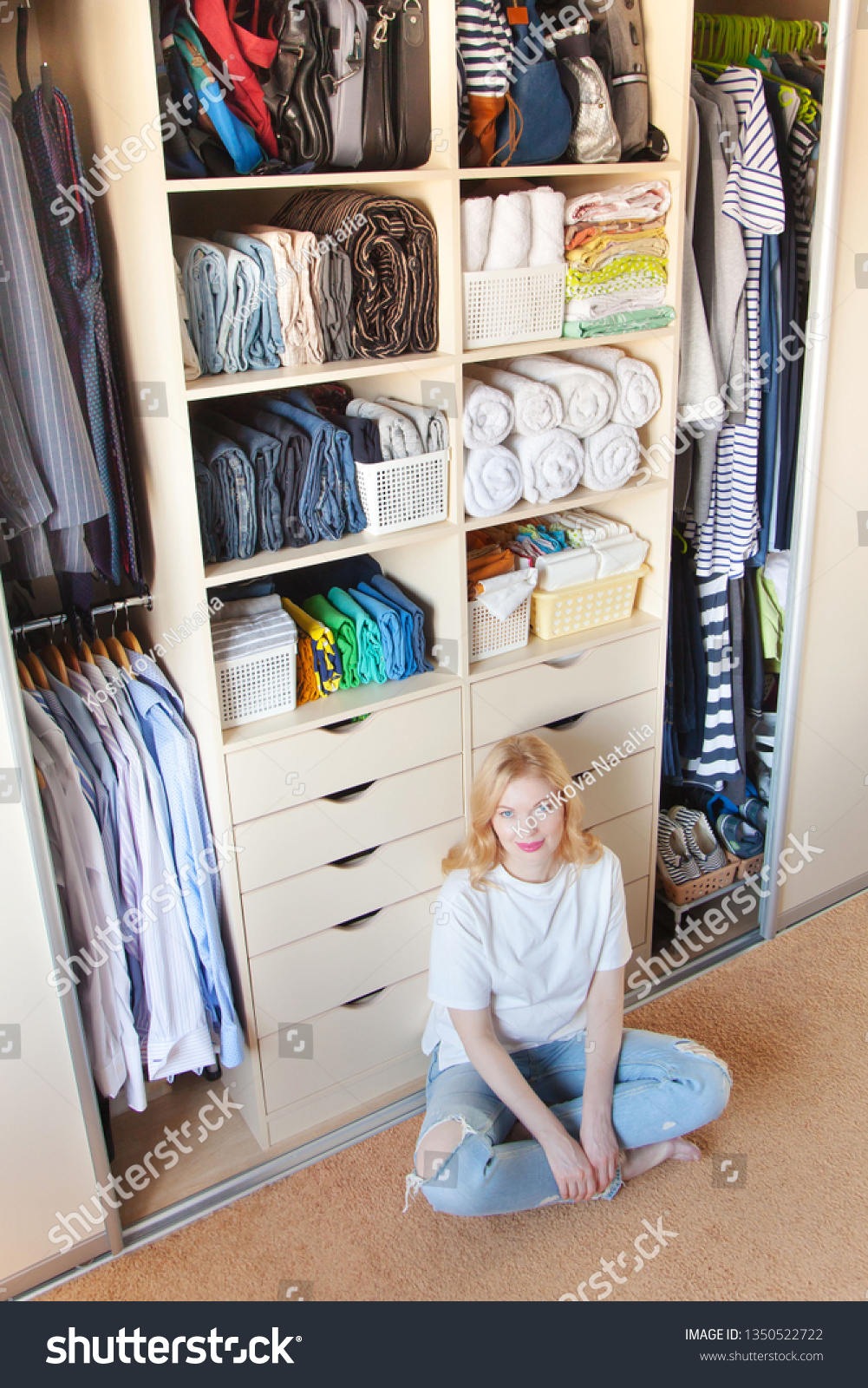 Woman Sitting Near Wardrobe Cleaning Closet Stock Photo Edit Now