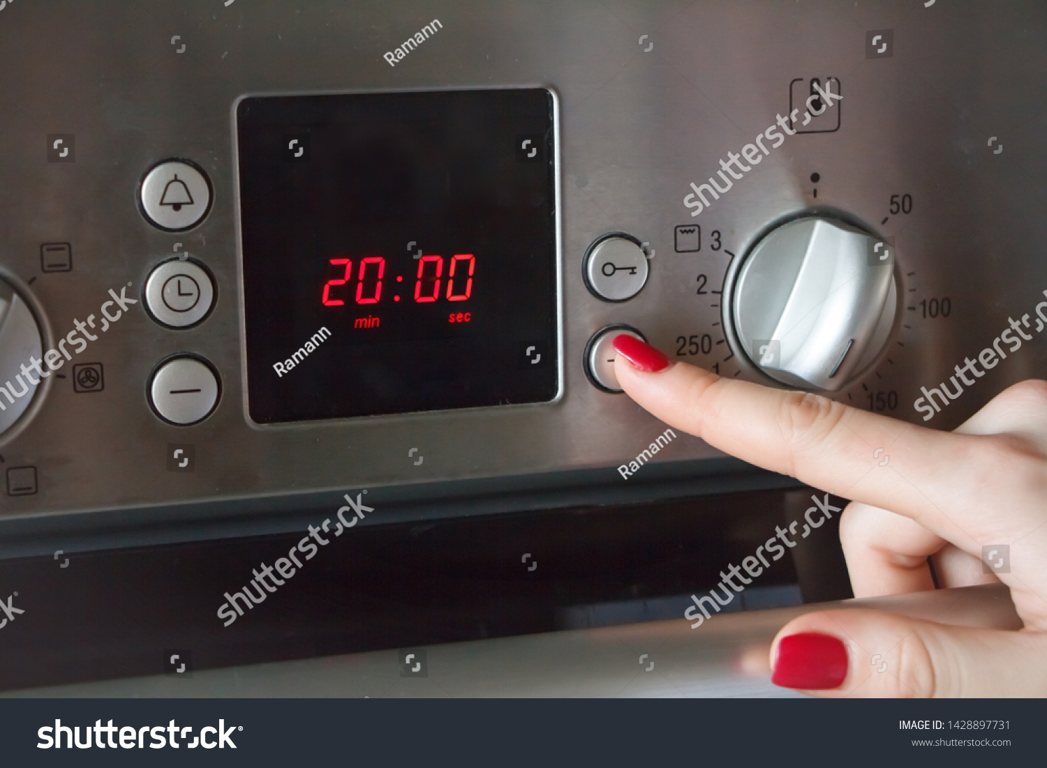 Womans Hand Puts On Oven Time Stock Photo (Edit Now) 1428897731