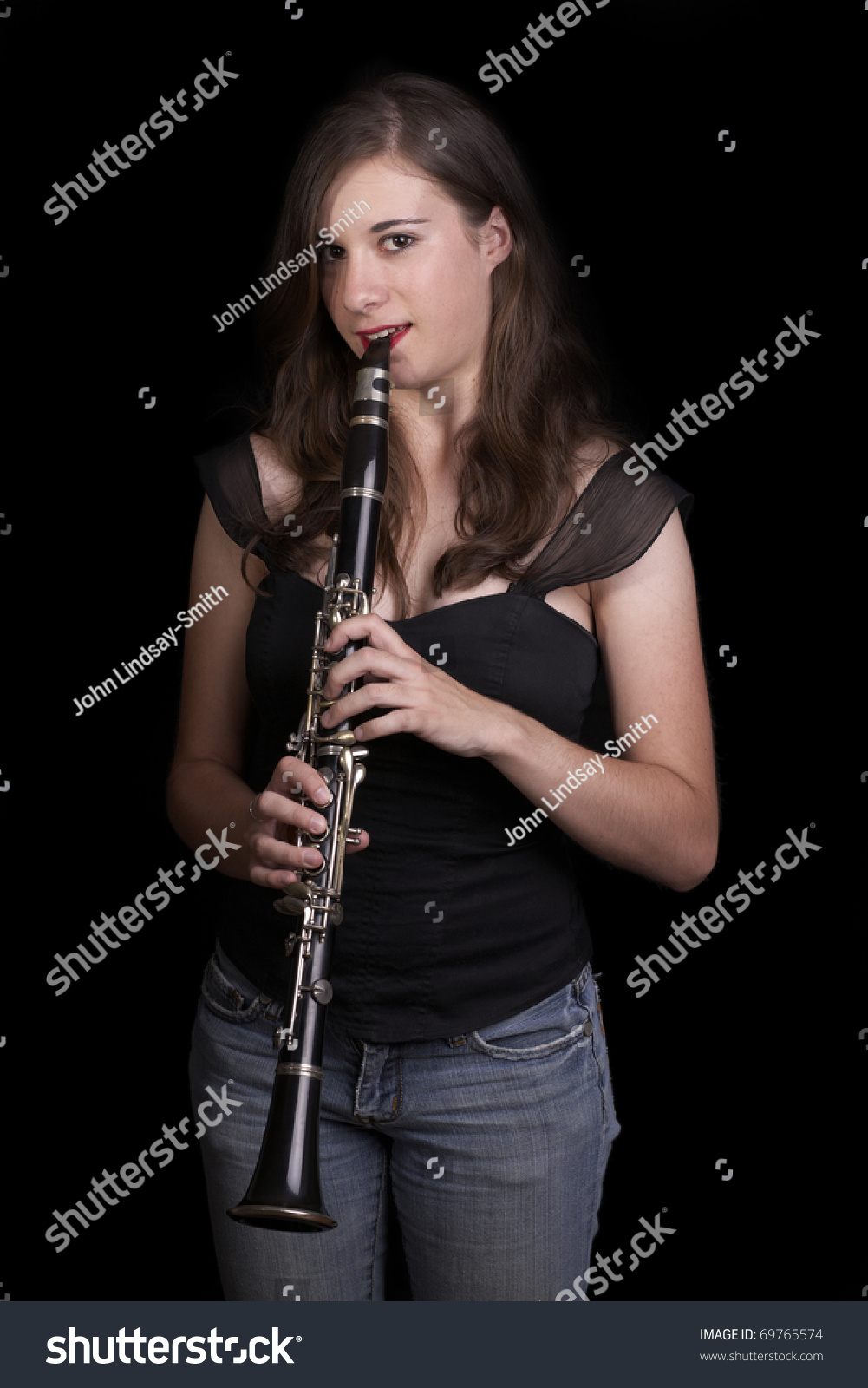 A Young Girl Plays The Clarinet - Low Key Stock Photo 69765574 ...