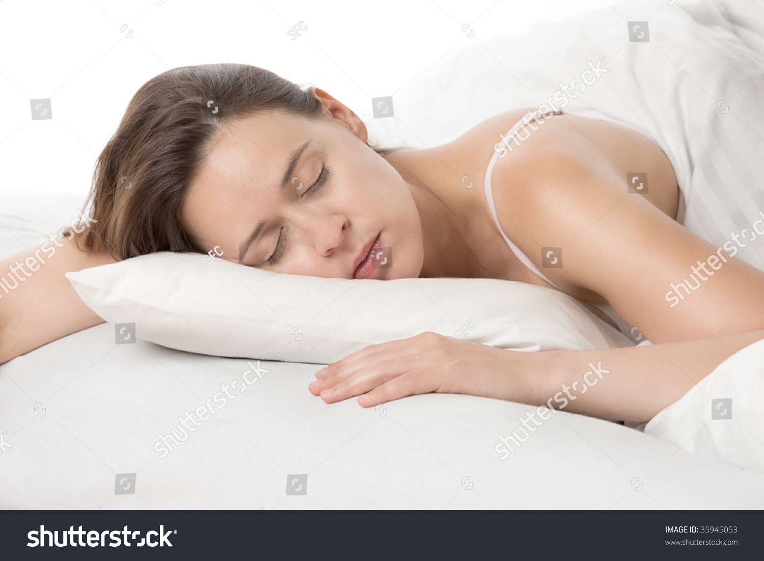 A Young Woman Sleeping Soundly On White Bedsheets. Stock Photo 35945053 ...