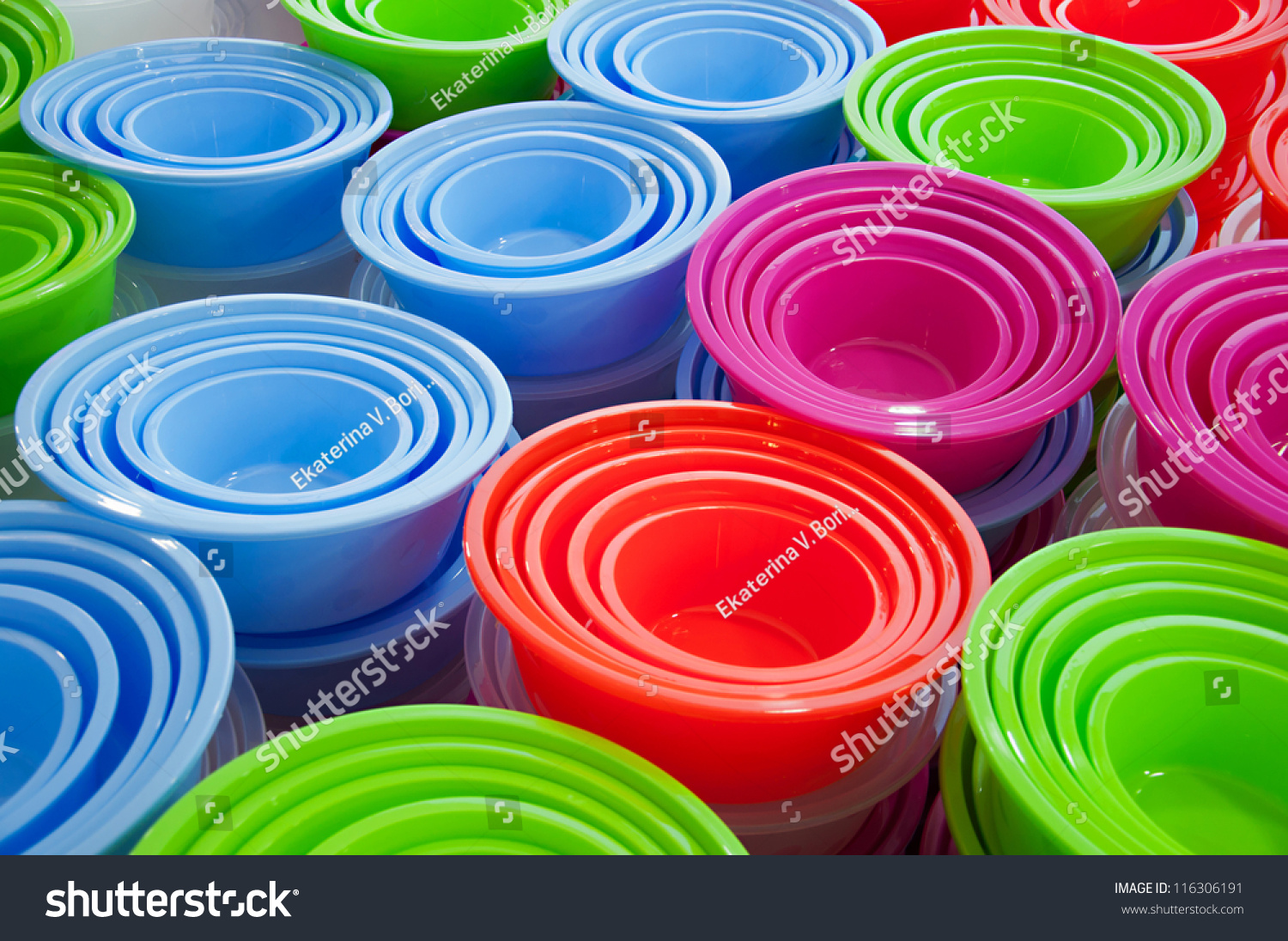 Abstract Background Of Different Colored Plastic Basins At A Market ...