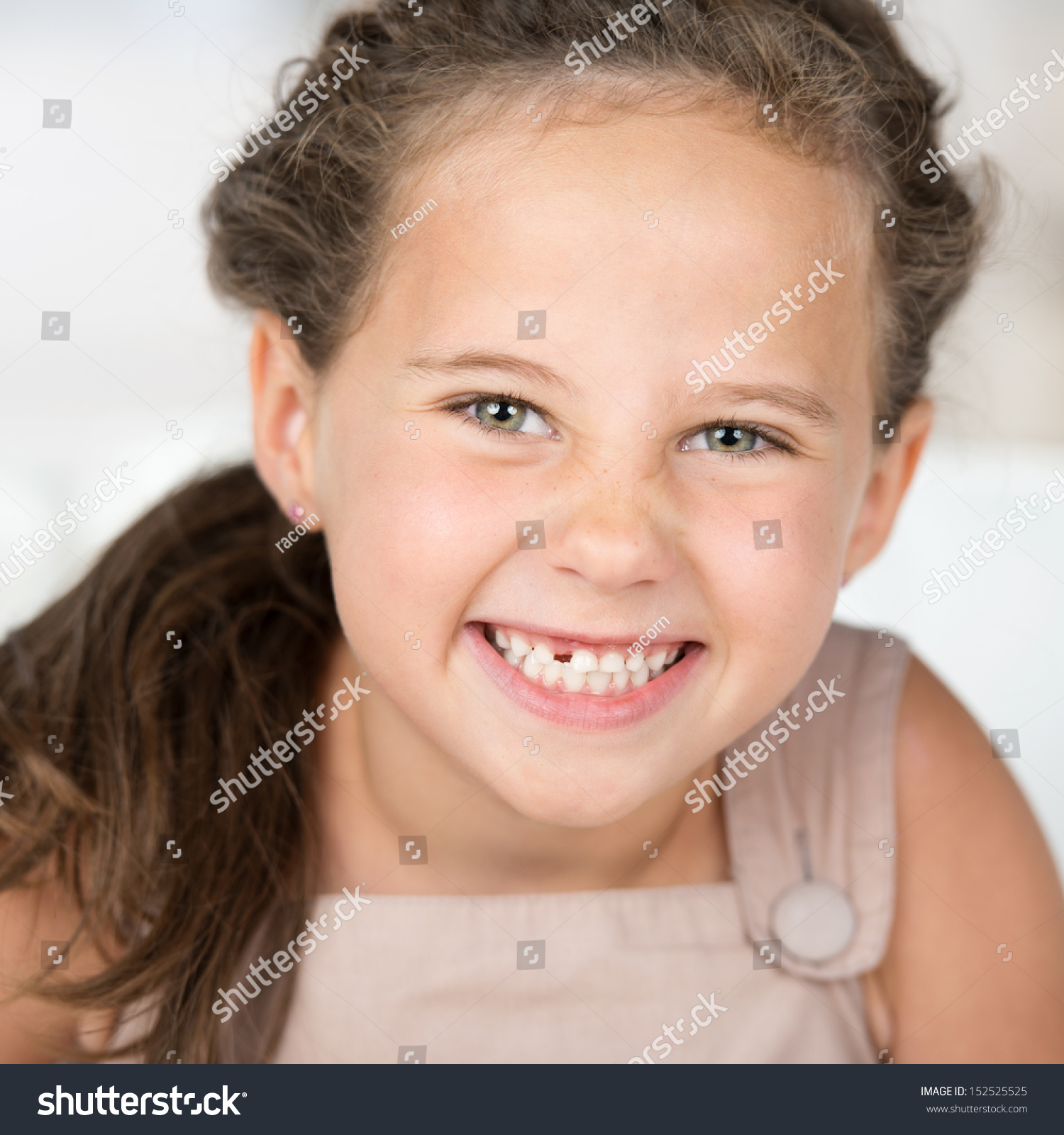 Adorable Beautiful Little Girl Grinning At The Camera Showing Off Her ...