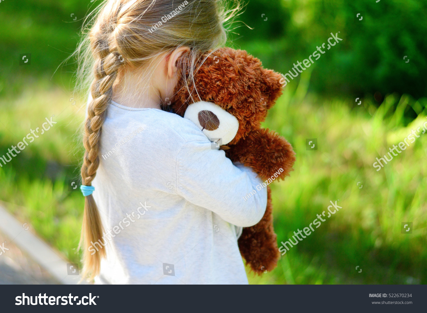sad teddy bear with girl