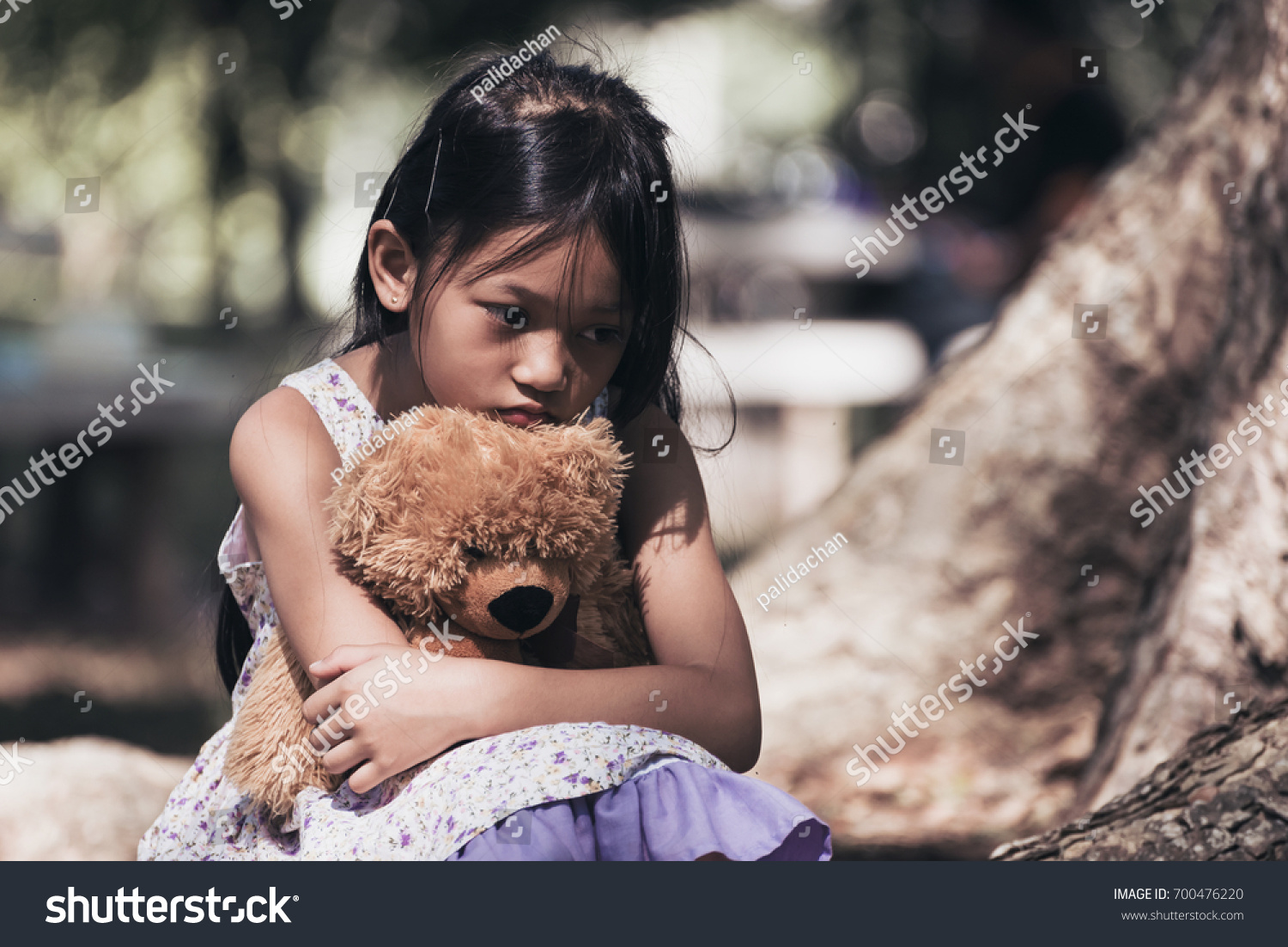 a girl with teddy bear