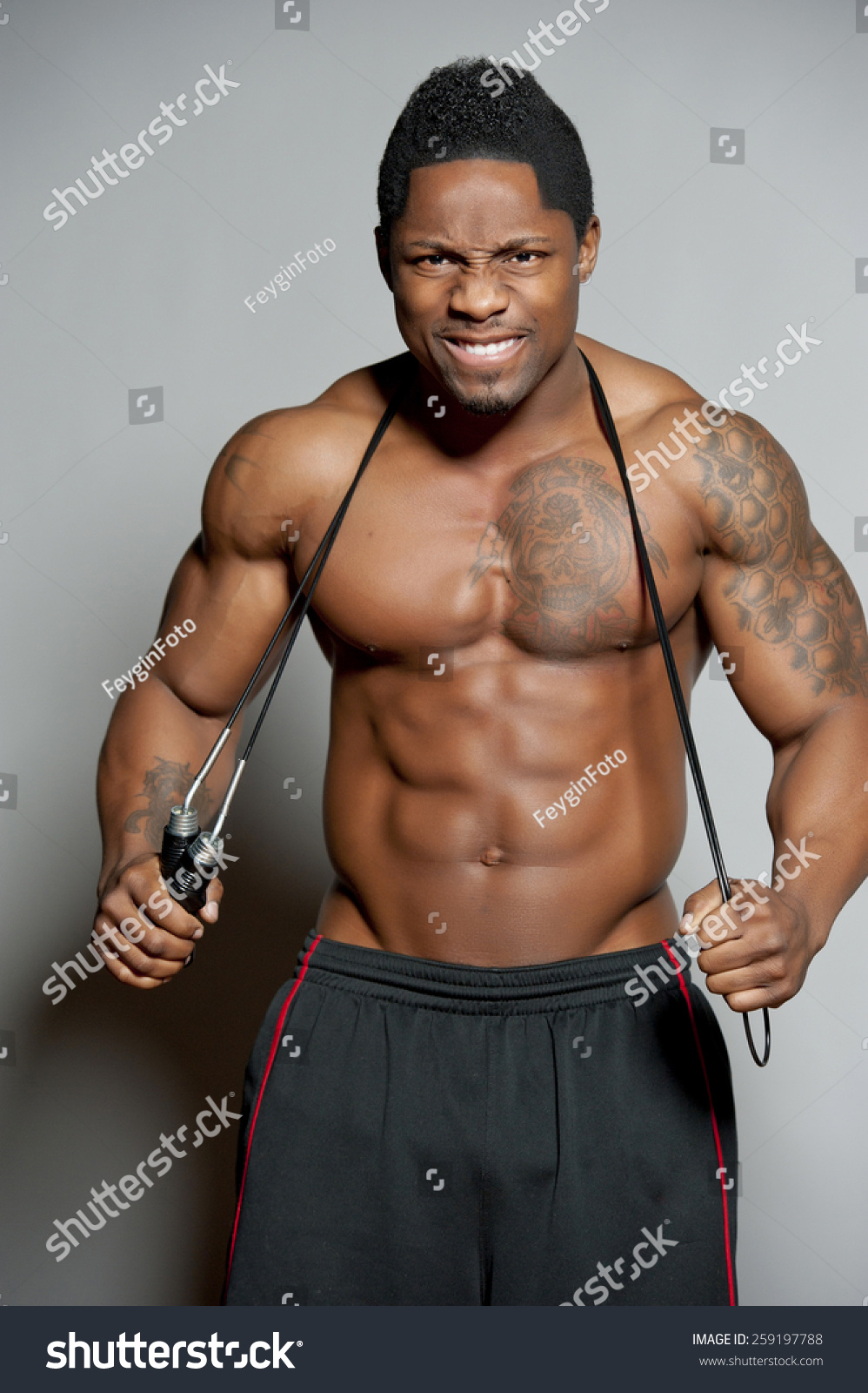 African American Body Builder Male Posing In A Studio Setting With Jump ...