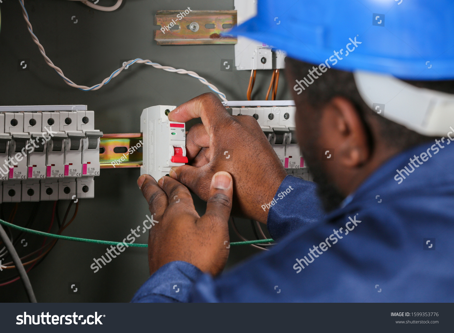 Africanamerican Electrician Performing Wiring Distribution Board Stock ...