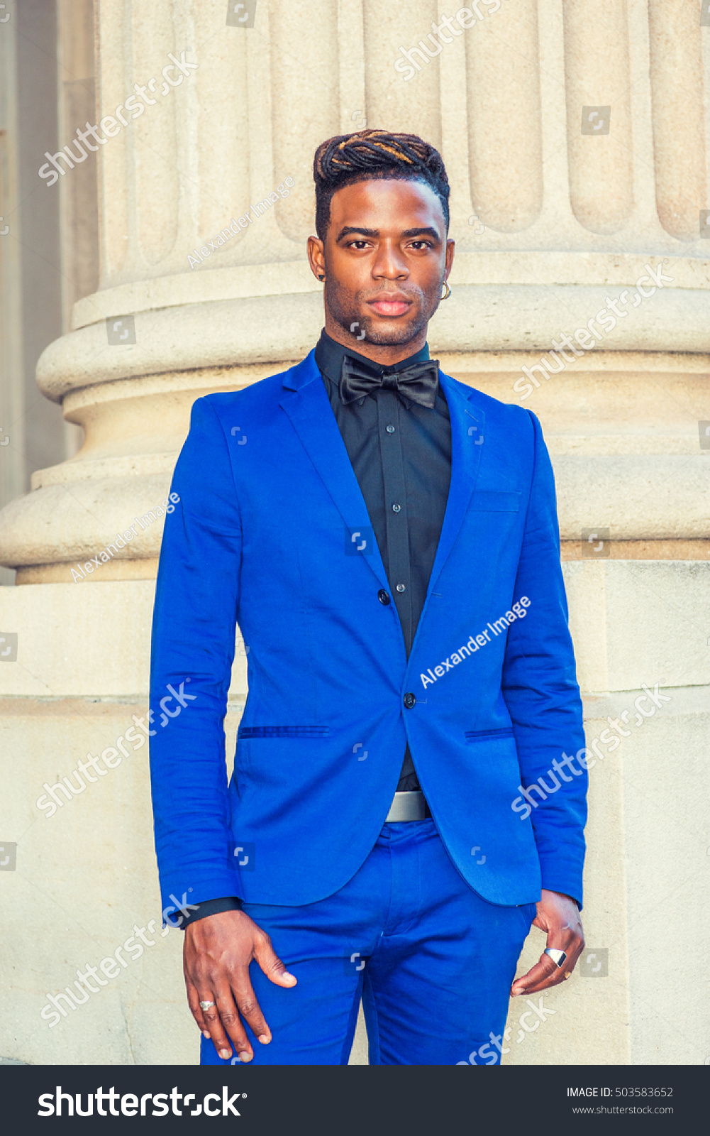 royal blue suit with black tie