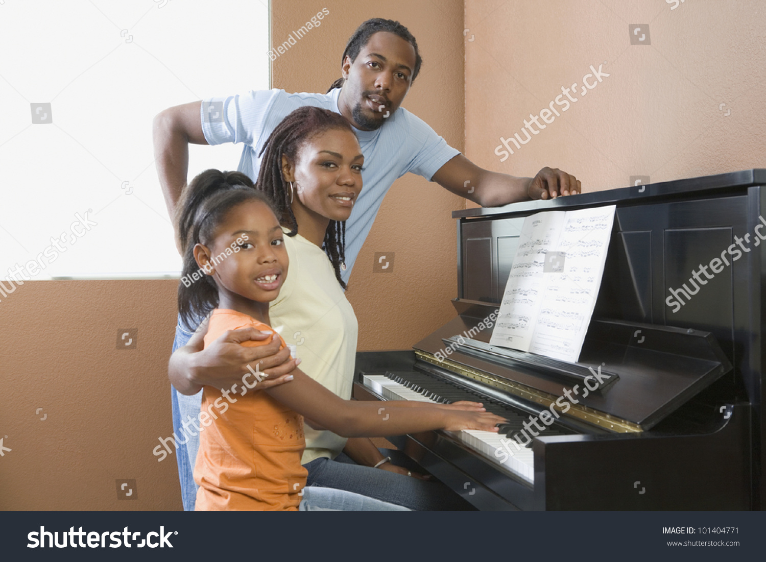 African Family Playing Piano Stock Photo 101404771 - Shutterstock