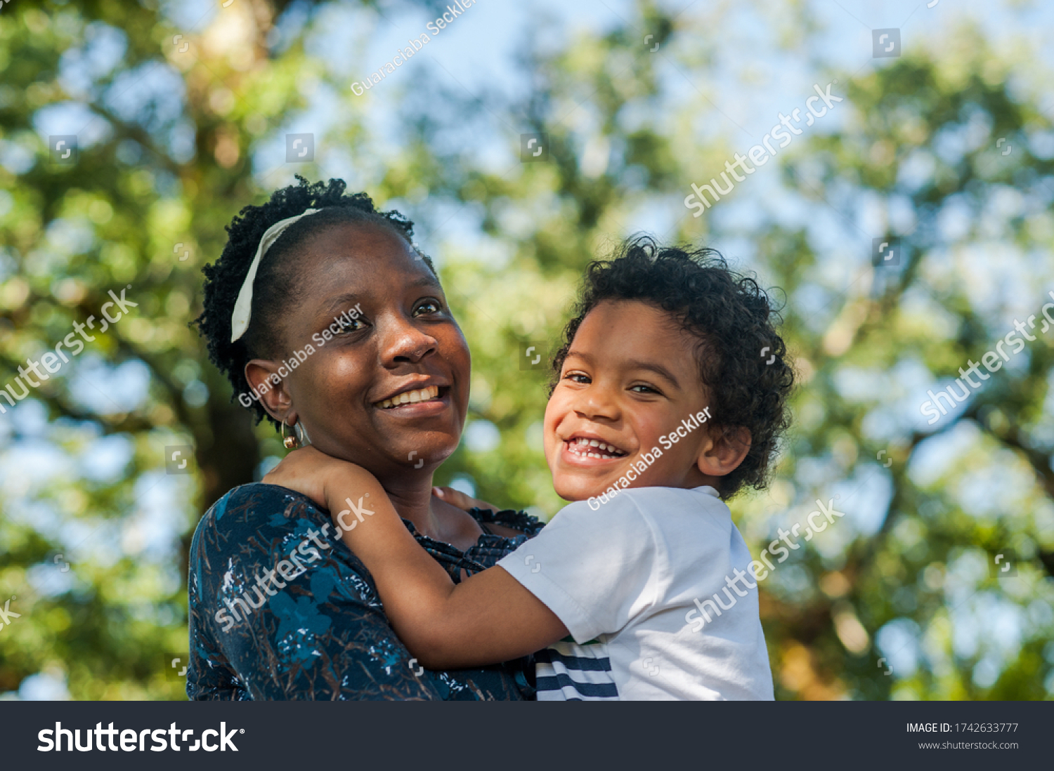 African Mom Happily Hugging Her Child Stock Photo 1742633777 