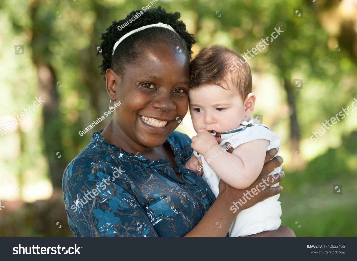 African Mom Holding Her Caucasian Baby Stock Photo 1742632466 ...