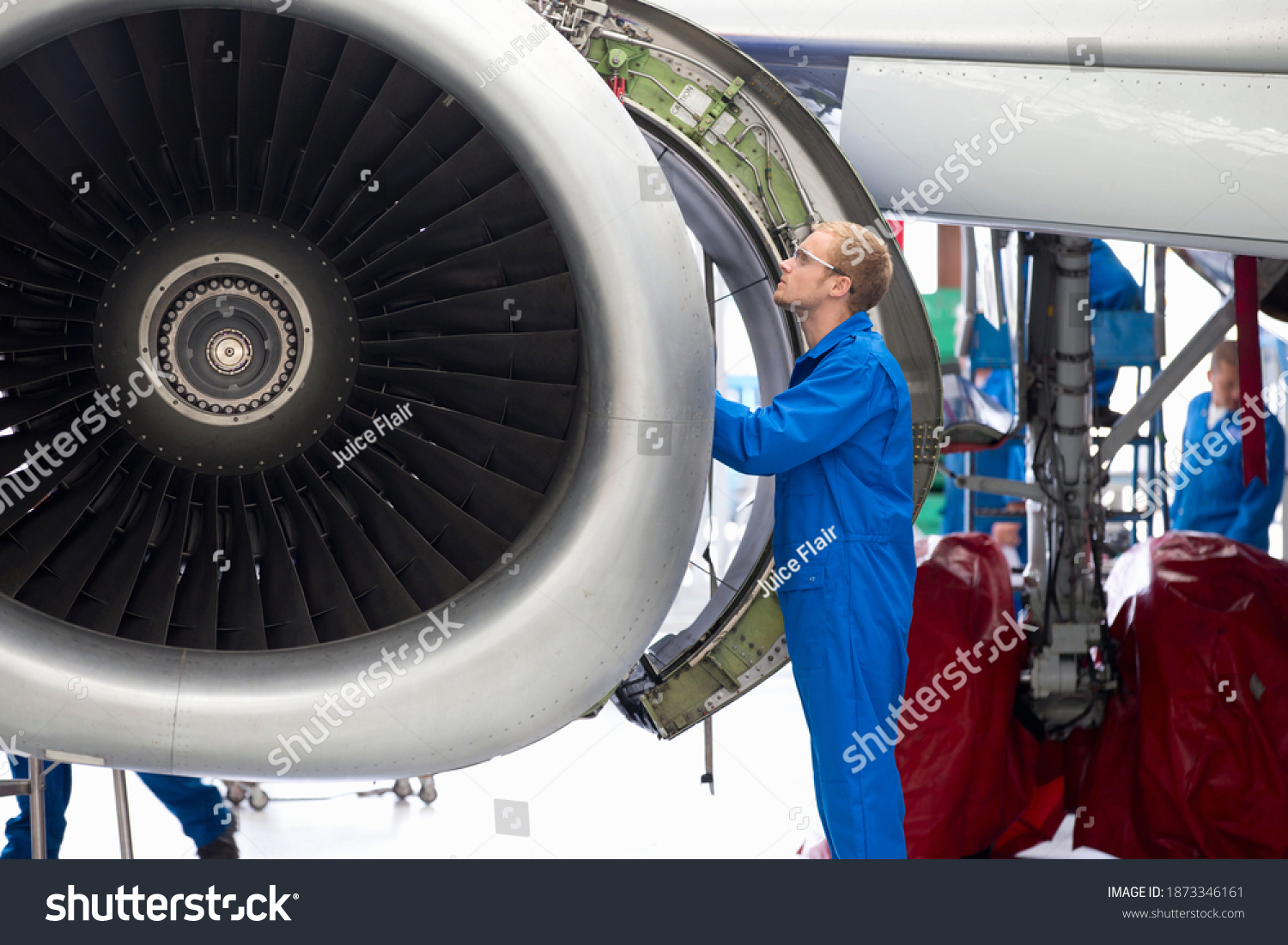 Aircraft Maintenance Technician Checking Airplane Engine Stock Photo Aircraft Maintenance Technician Checking Airplane Engine Stock Photo