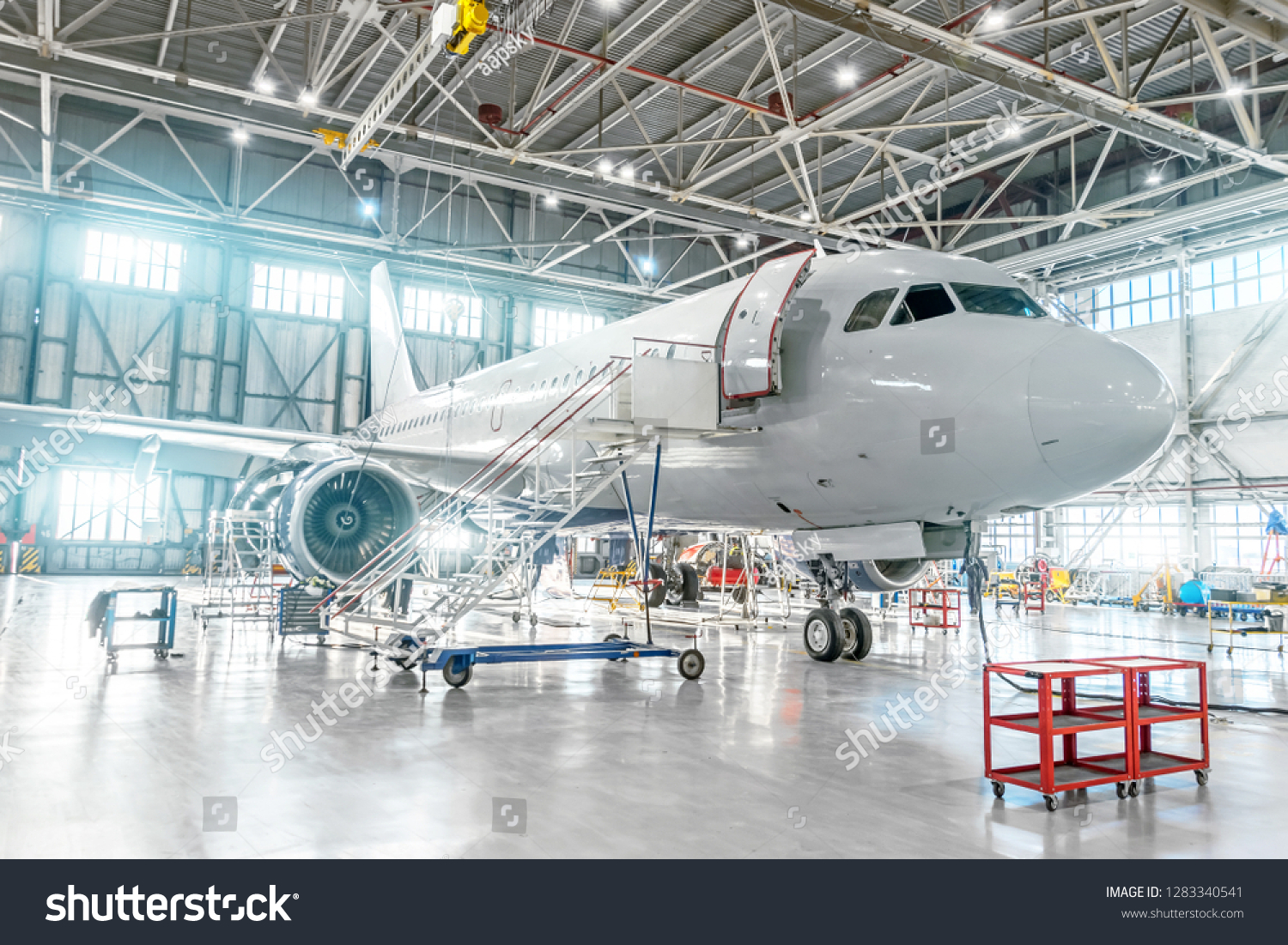 Aircraft Under Maintenance Checking Mechanical Systems Stock Photo ...