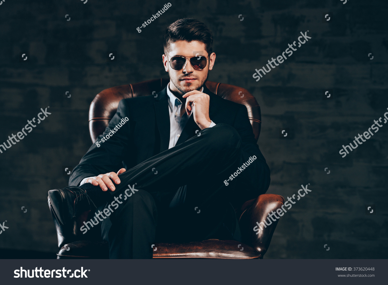 1 619 Sitting Cross Legged Chair Male Bilder Stockfotos Und   Stock Photo All About Style Young Handsome Man In Suit And Sunglasses Holding Hand On Chin And Looking At 373620448 