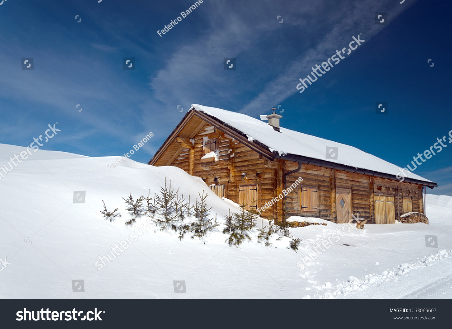 stock-photo-alpine-chalet-surrounded-by-
