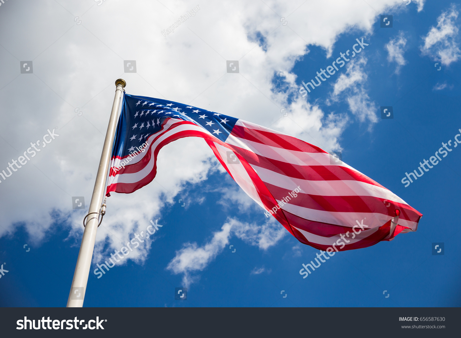 American Flag Against Blue Sky Clouds Stock Photo 656587630 | Shutterstock