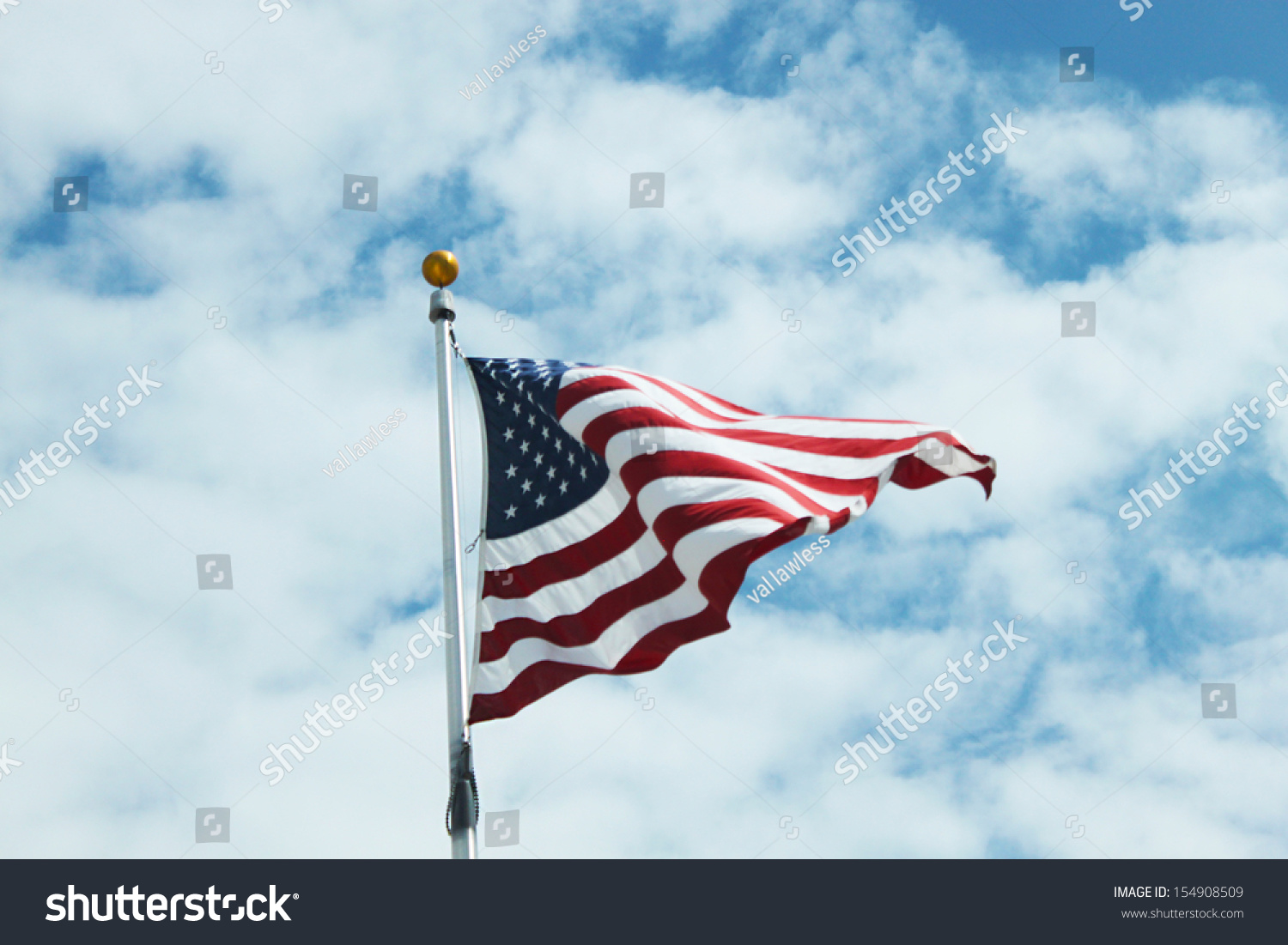 American Flag Against Bright Sky Clouds Stock Photo 154908509 ...