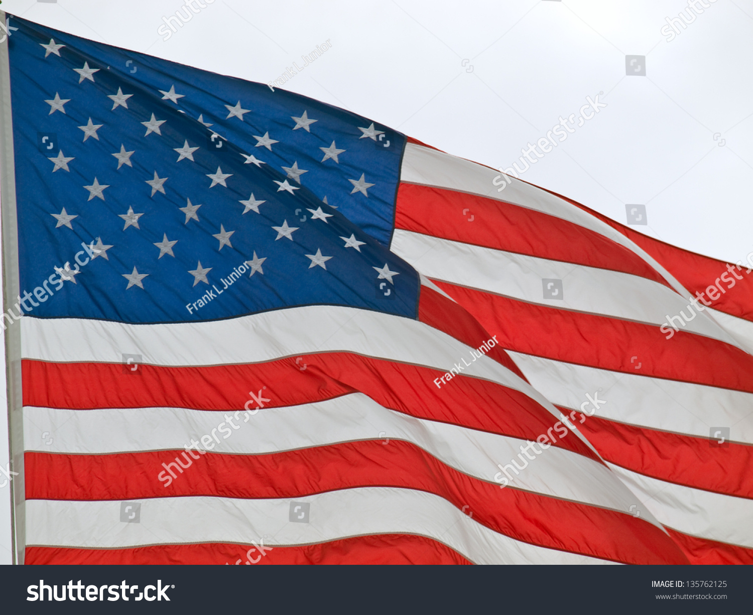 American Flag Flying Proudly In The Wind Stock Photo 135762125 ...