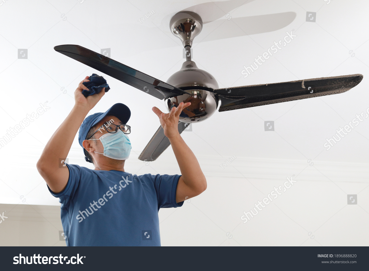 1 024 Cleaning Ceiling Fans Images Stock Photos Vectors Shutterstock   Stock Photo An Asian Chinese Male Cleaning Ceiling Fan At Home 1896888820 