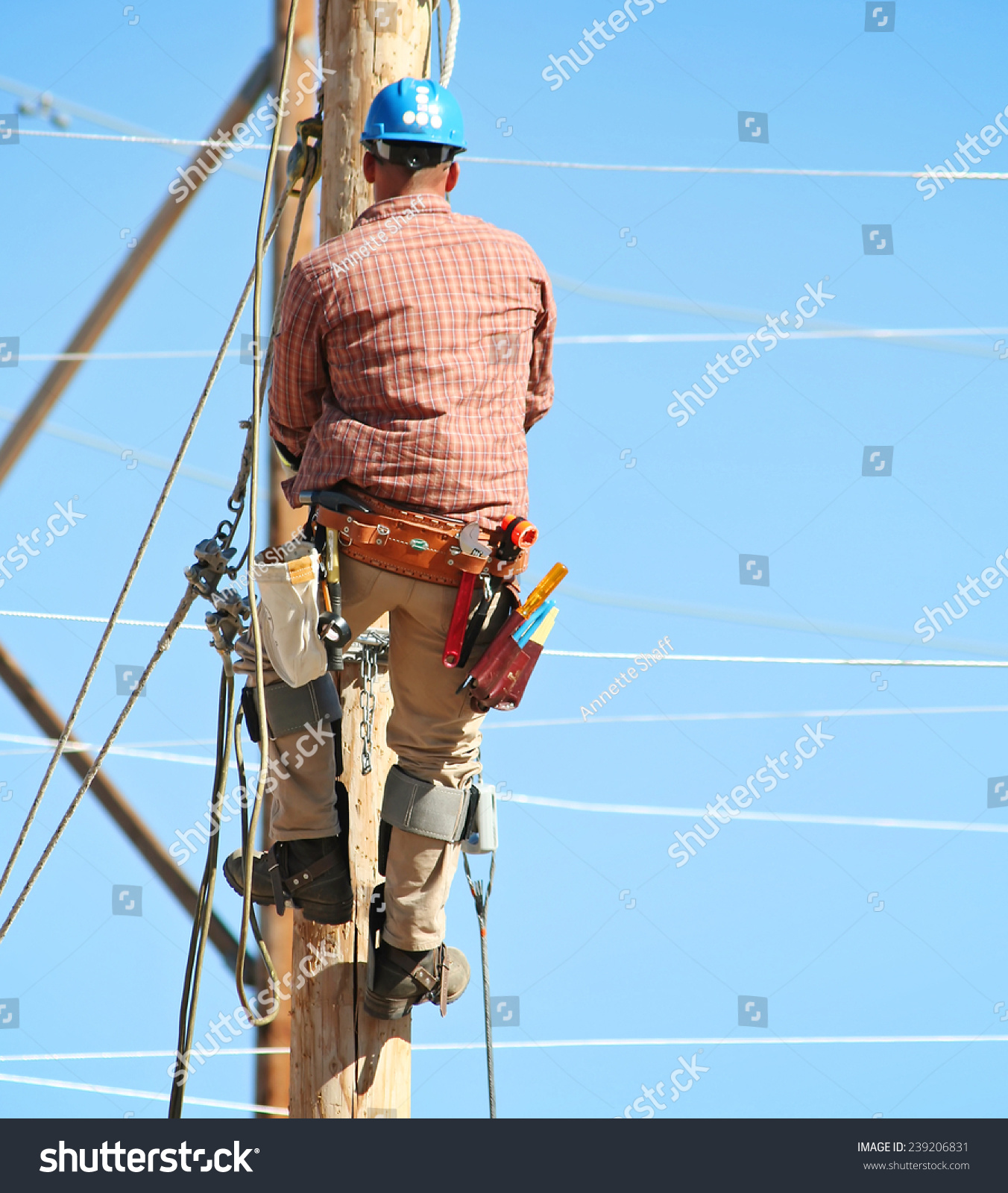 An Electrical Lineman Student Working On A Pole At A Lineman College ...