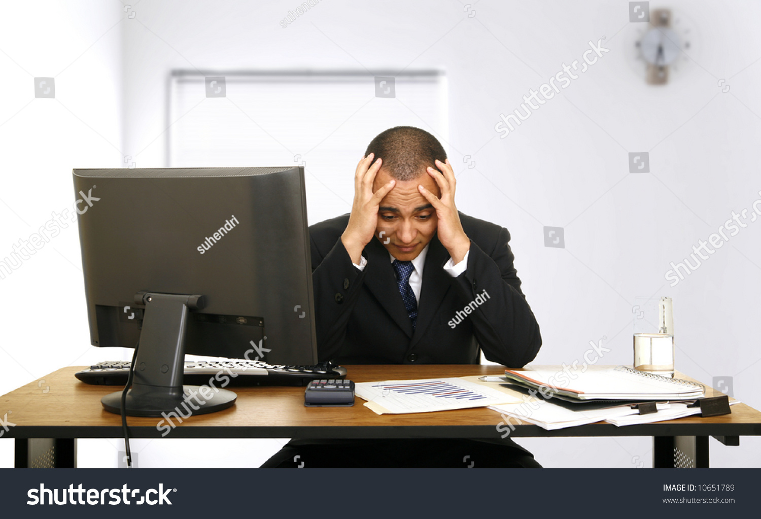 Employee Stressed Out Holding His Head Stock Photo 10651789 - Shutterstock