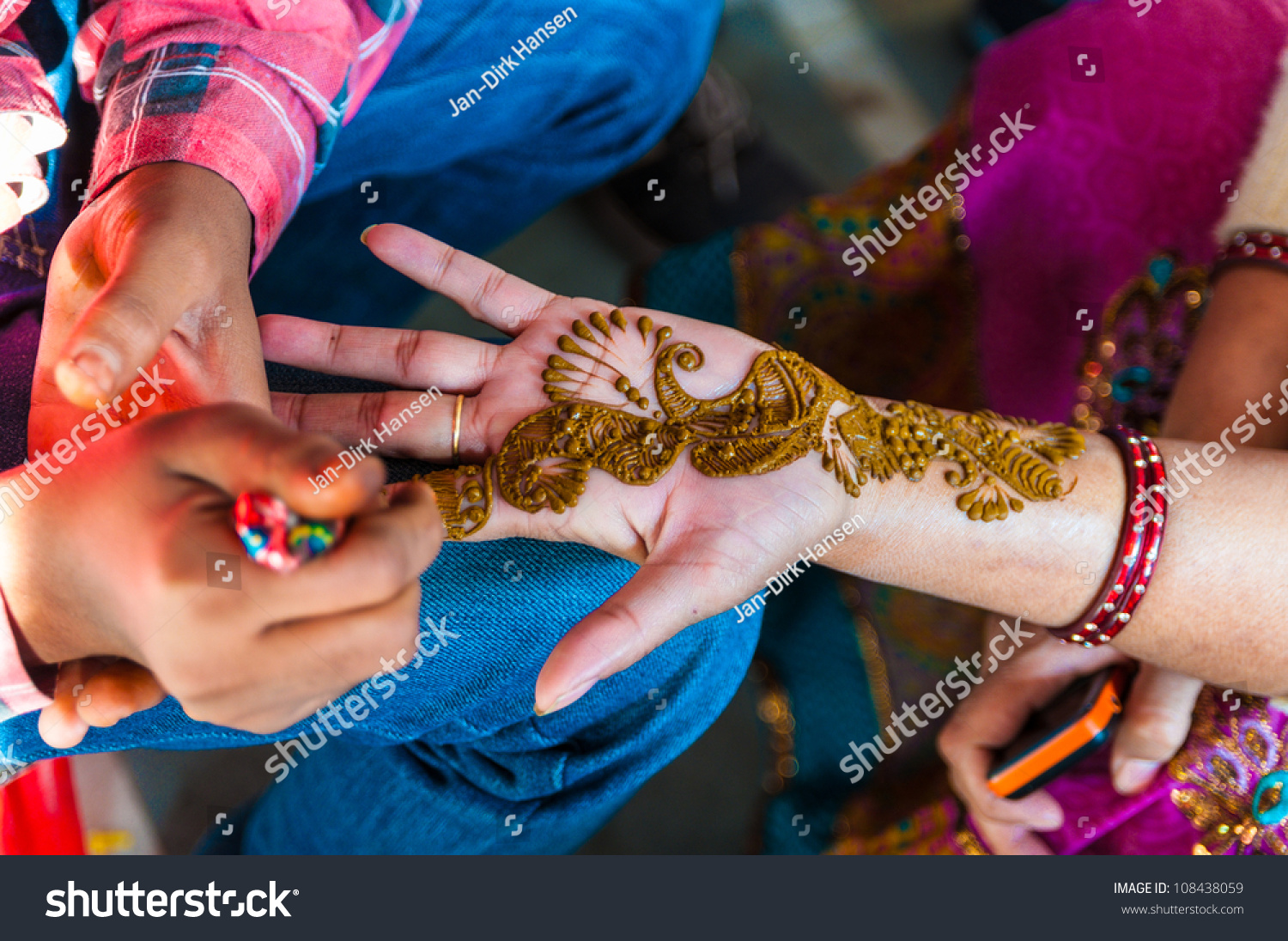 indian woman gets henna tattoos on stock photo 108438059 indian woman gets henna tattoos on stock photo 108438059