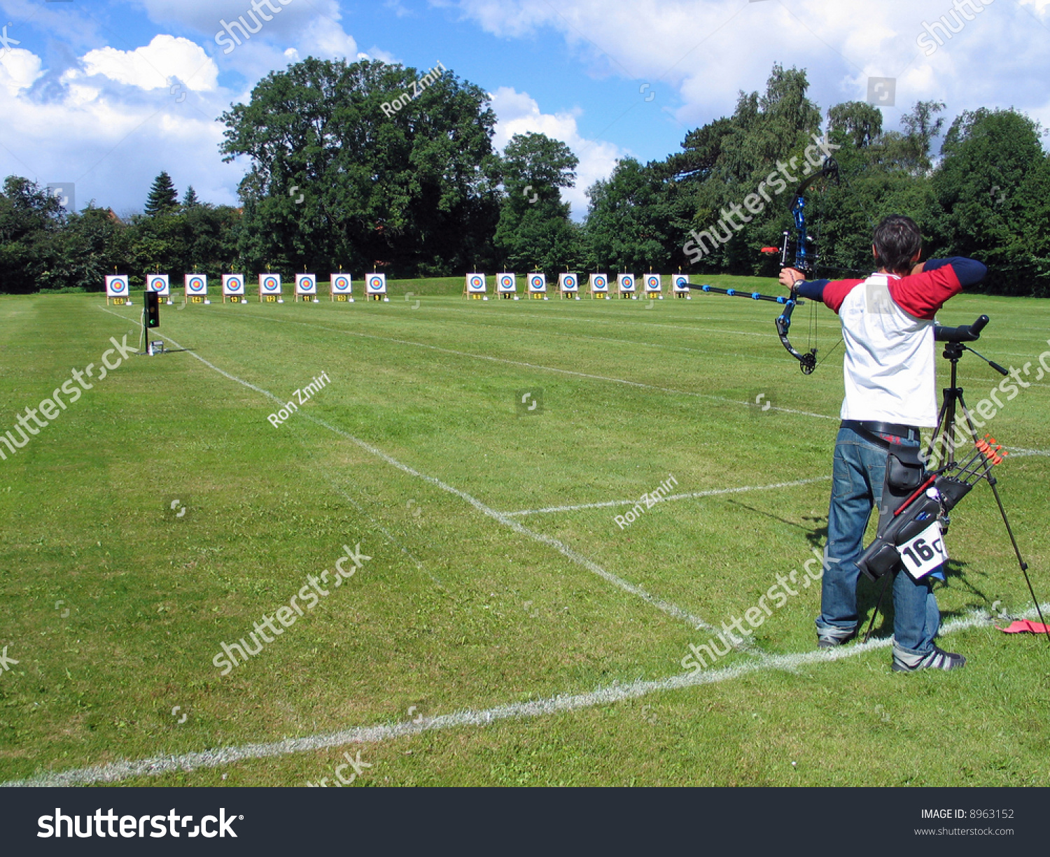 An Official Target Shooting - An Archer Aim And Shoots Stock Photo ...