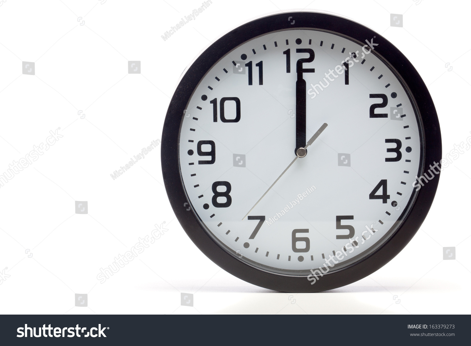 Analog Clock With Black Frame, Showing Time Of 12 O'Clock Sharp, Noon ...