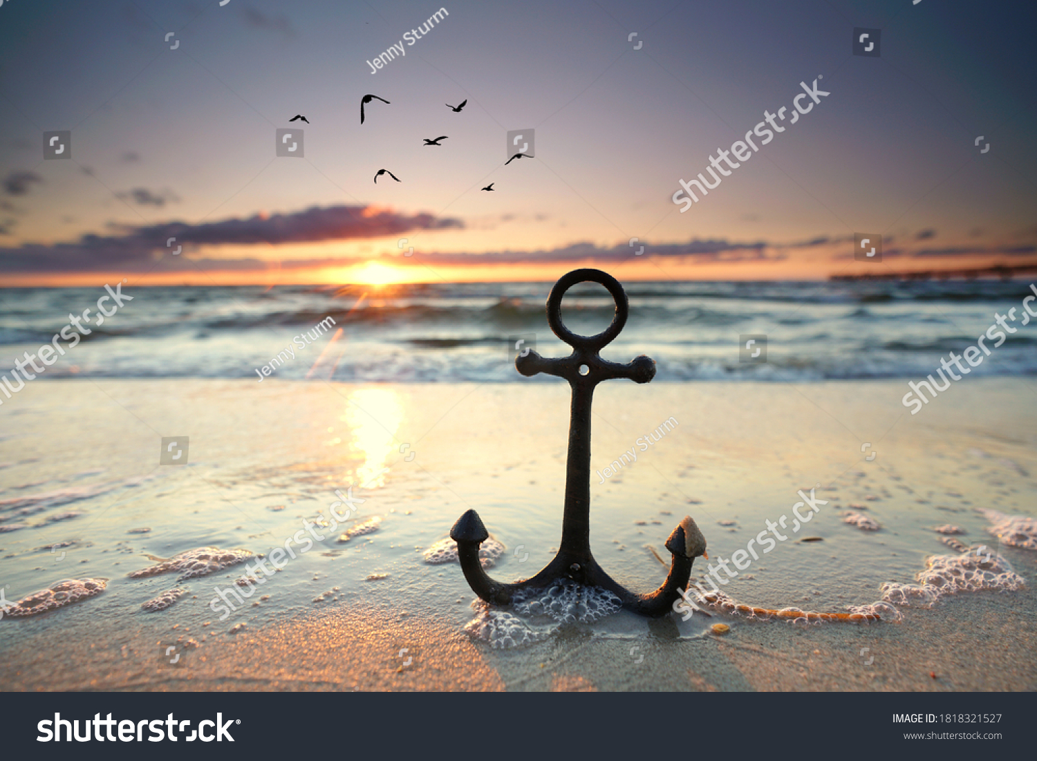 stock-photo-anchor-at-the-beach-with-sunset-light-1818321527.jpg