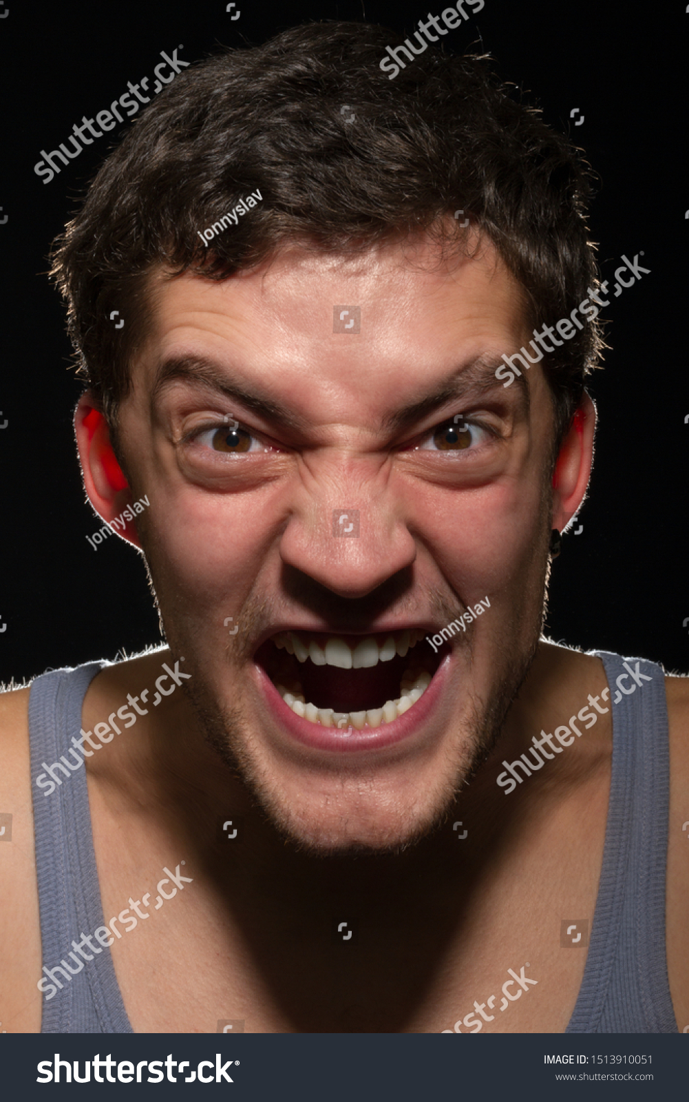 angry-young-man-shouting-vertically-framed-stock-photo-edit-now