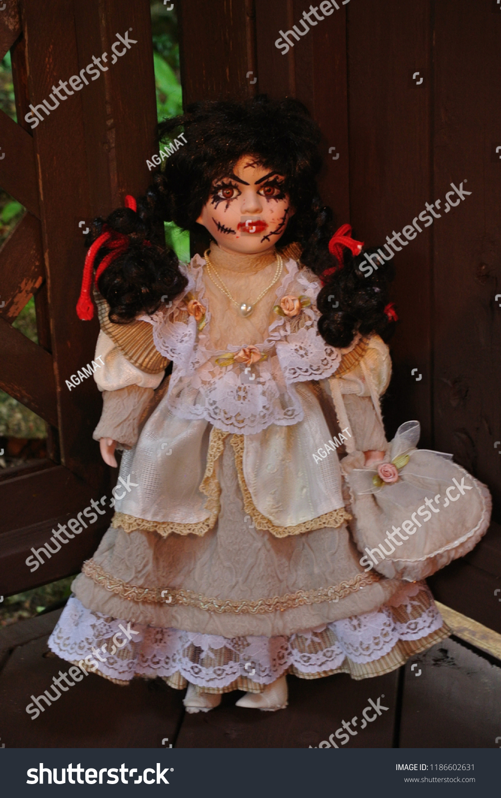 creepy girl with black hair and doll