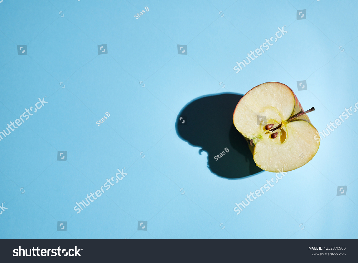 Apple On Light Blue Background Stock Photo Edit Now 1252870900