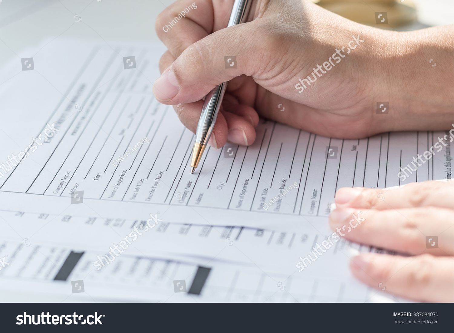 applicant filling in company application form document applying for