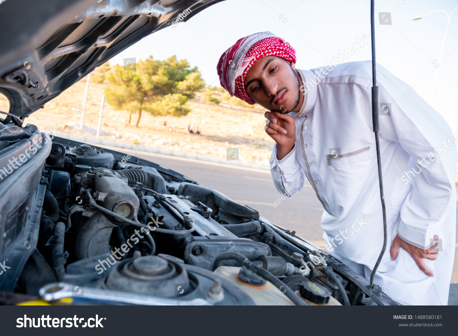 Arabic Man Fixing His Car Stock Photo (Edit Now) 1488580181