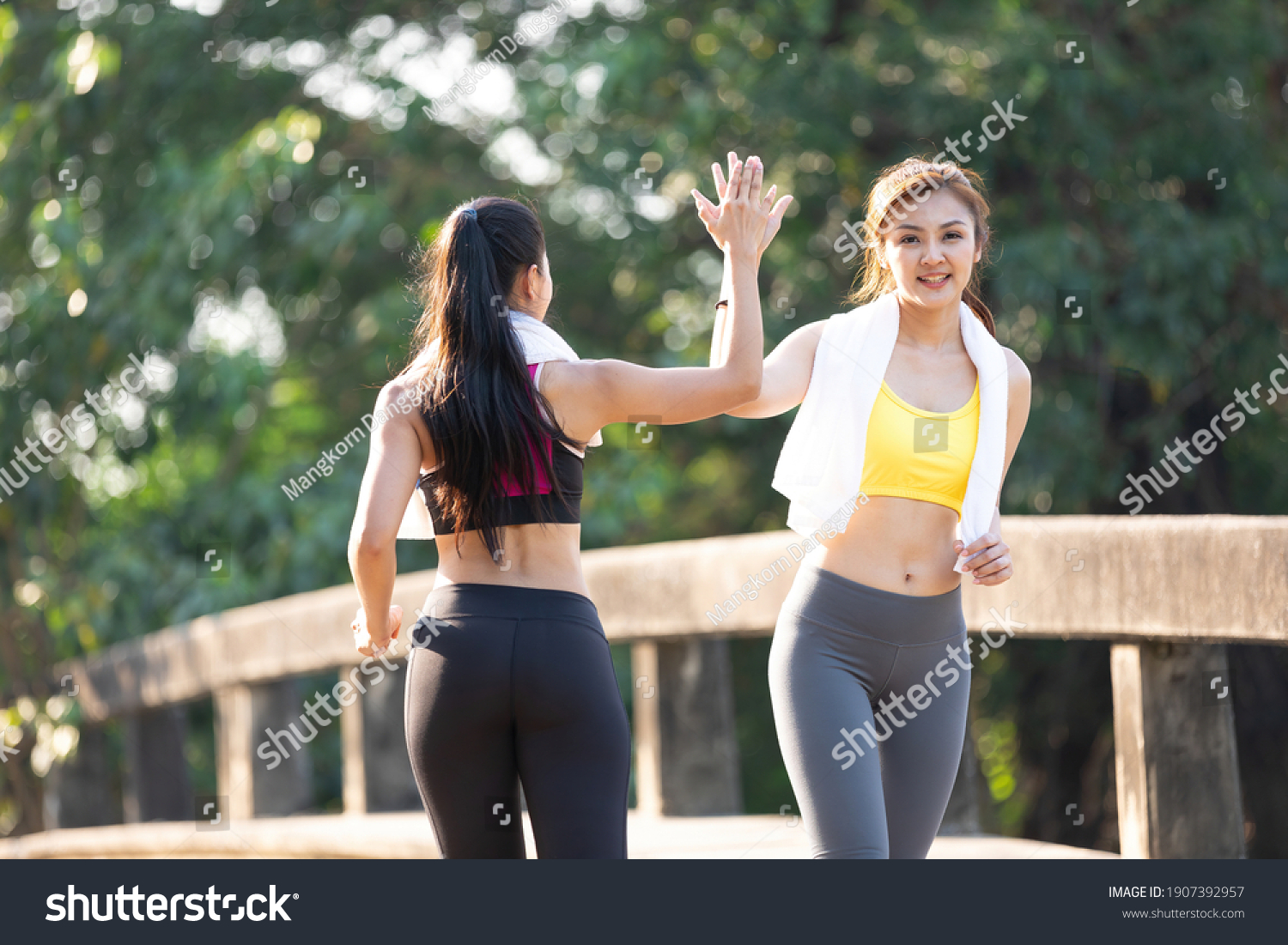 Asian Athletes Couple Hitting Hand High Stock Photo 1907392957 ...