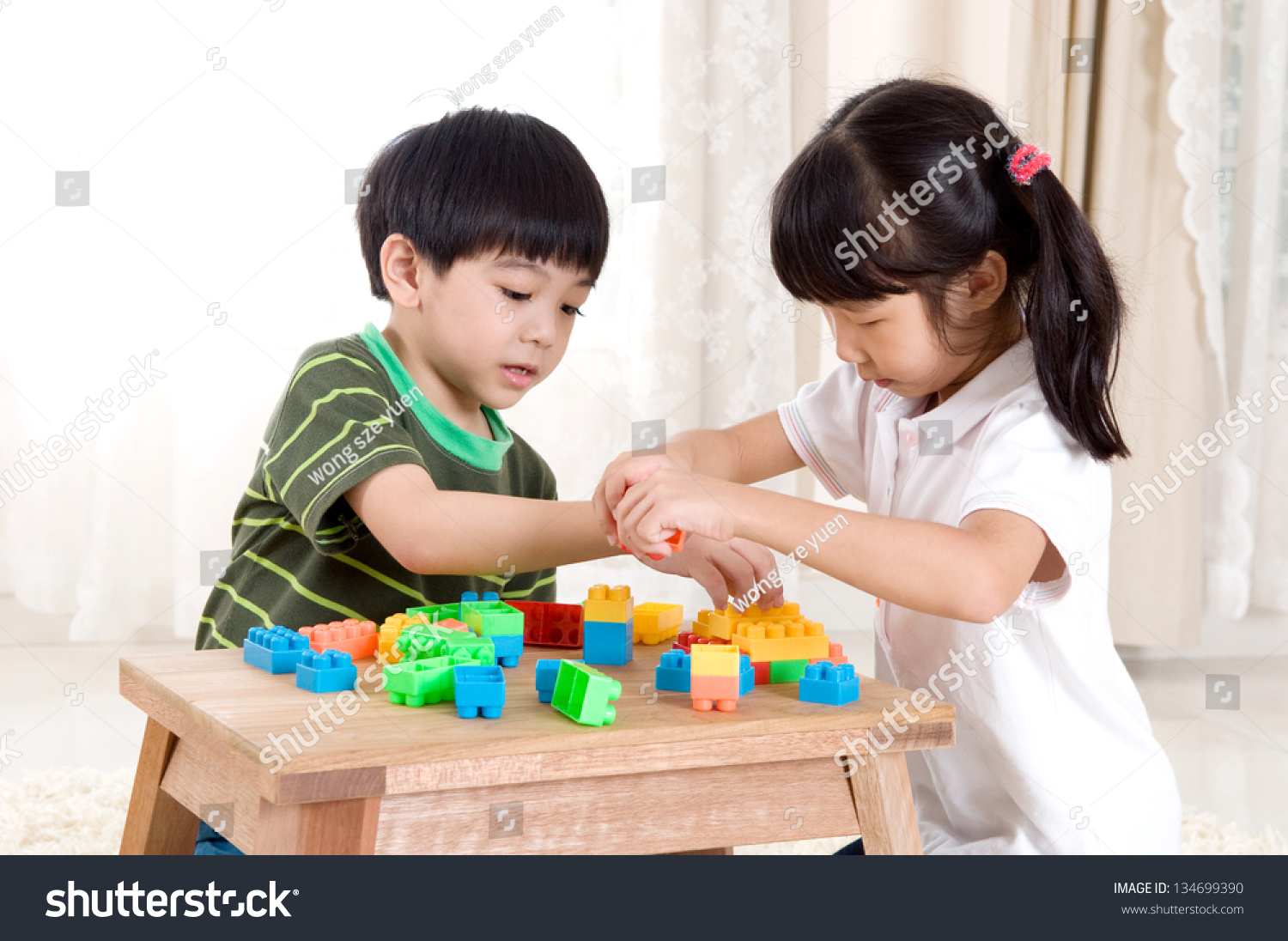 Asian Kids Piling Up Building Blocks Stock Photo 134699390 : Shutterstock