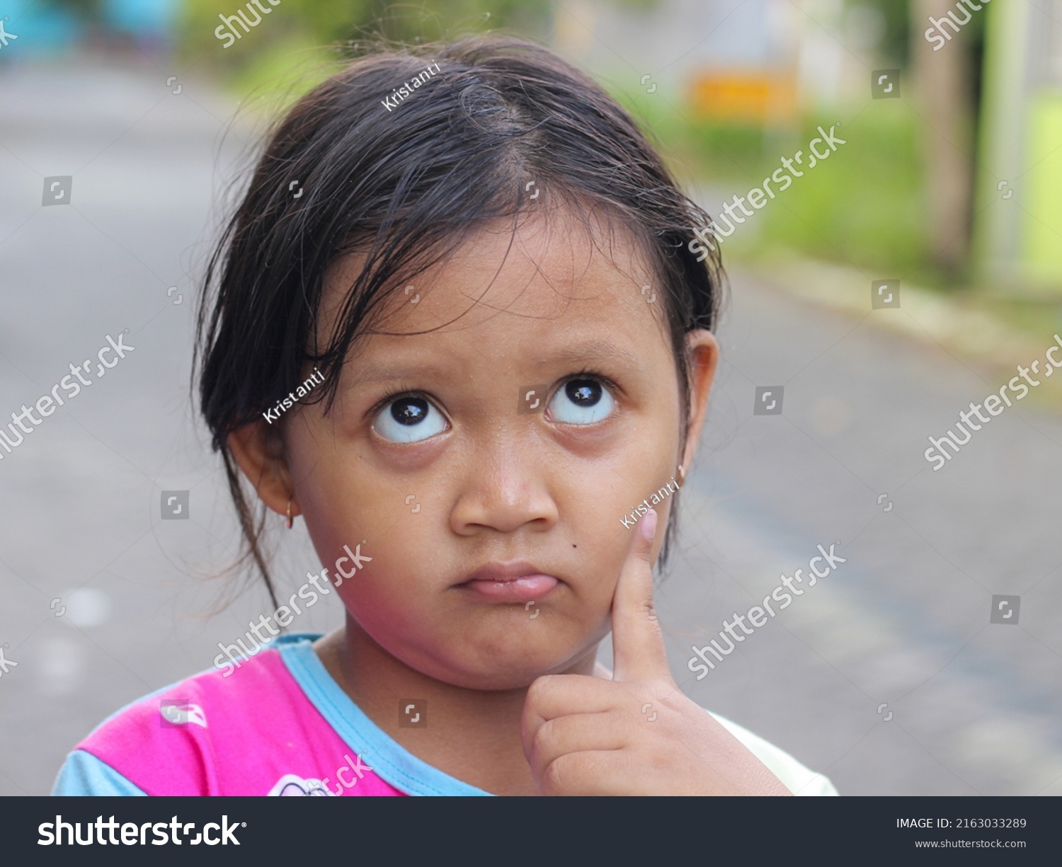 Asian Little Girl Thinking Rolling Eyes Stock Photo 2163033289 ...