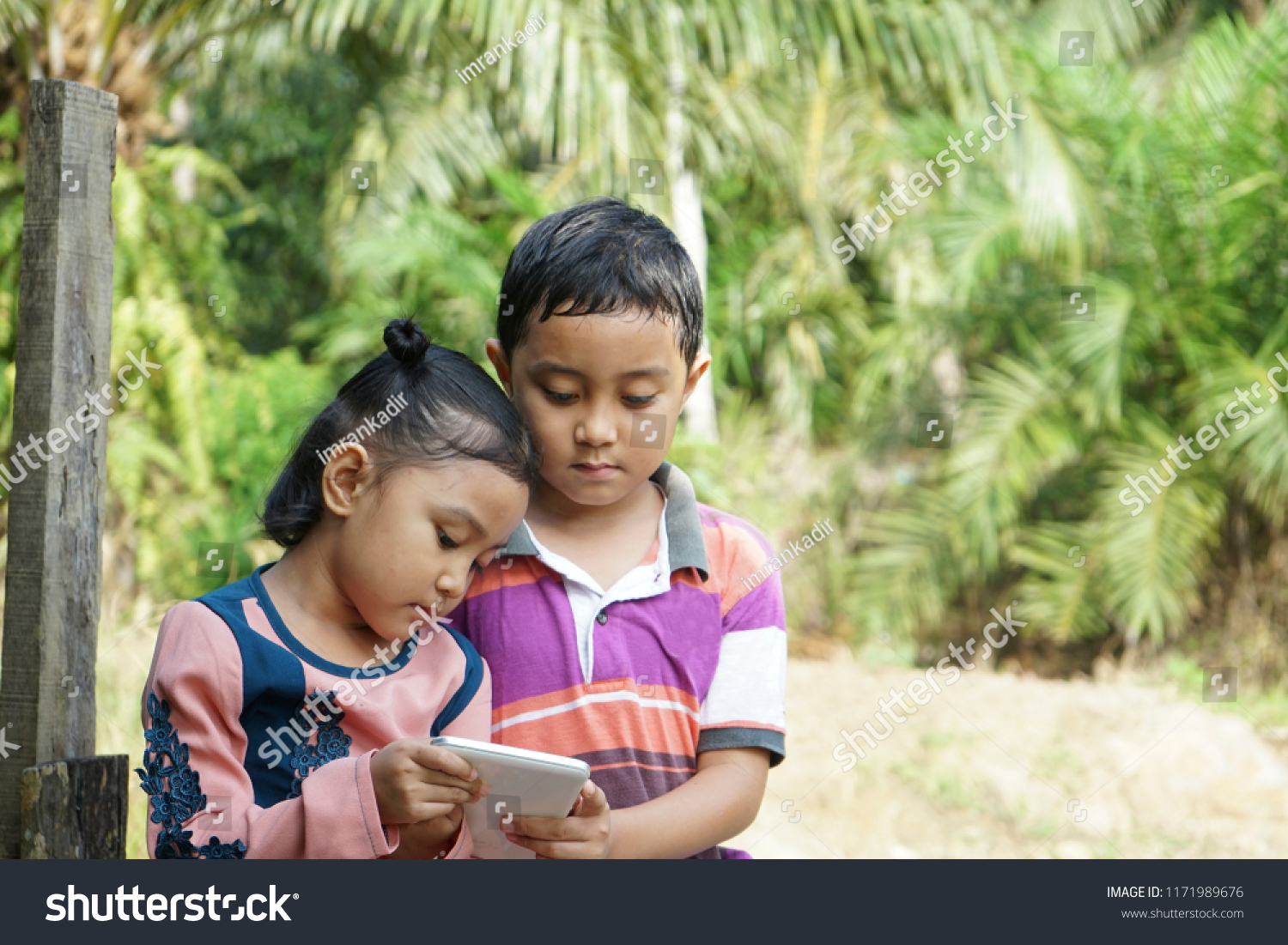 Asian Sibling Enjoying Application Mobile Tab Stock Photo (Edit 