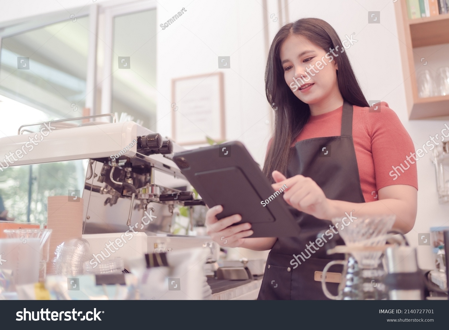 asian-woman-who-owns-coffee-shop-stock-photo-2140727701-shutterstock