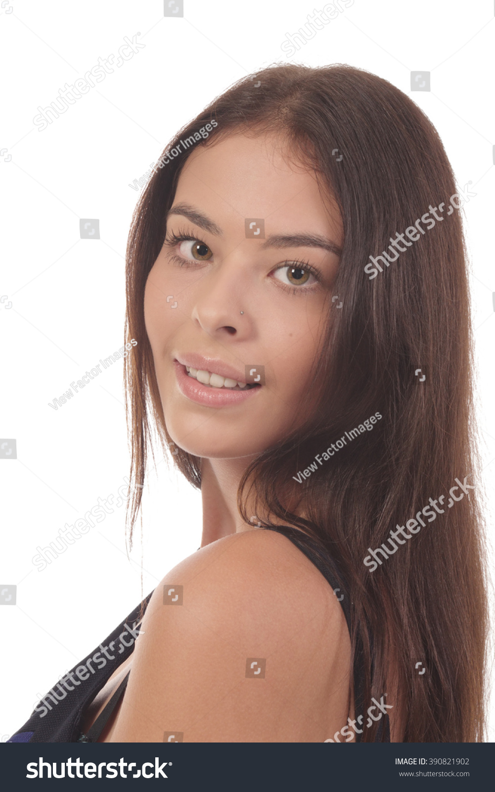 attractive-brunet-smiling-looking-over-shoulder-stock-photo-390821902