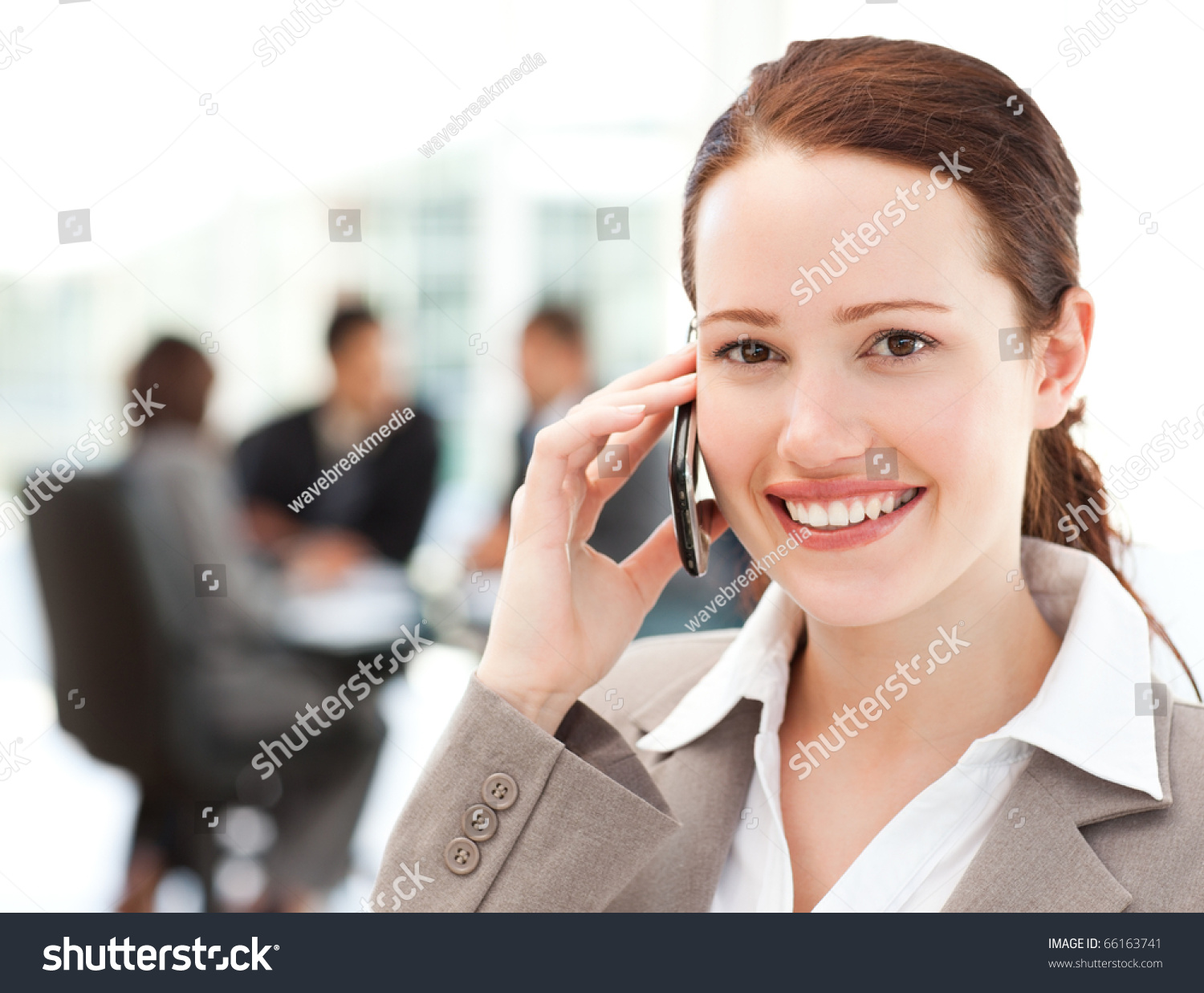 telephone english conversation operator for on in businesswoman working phone team the the is while her Attractive