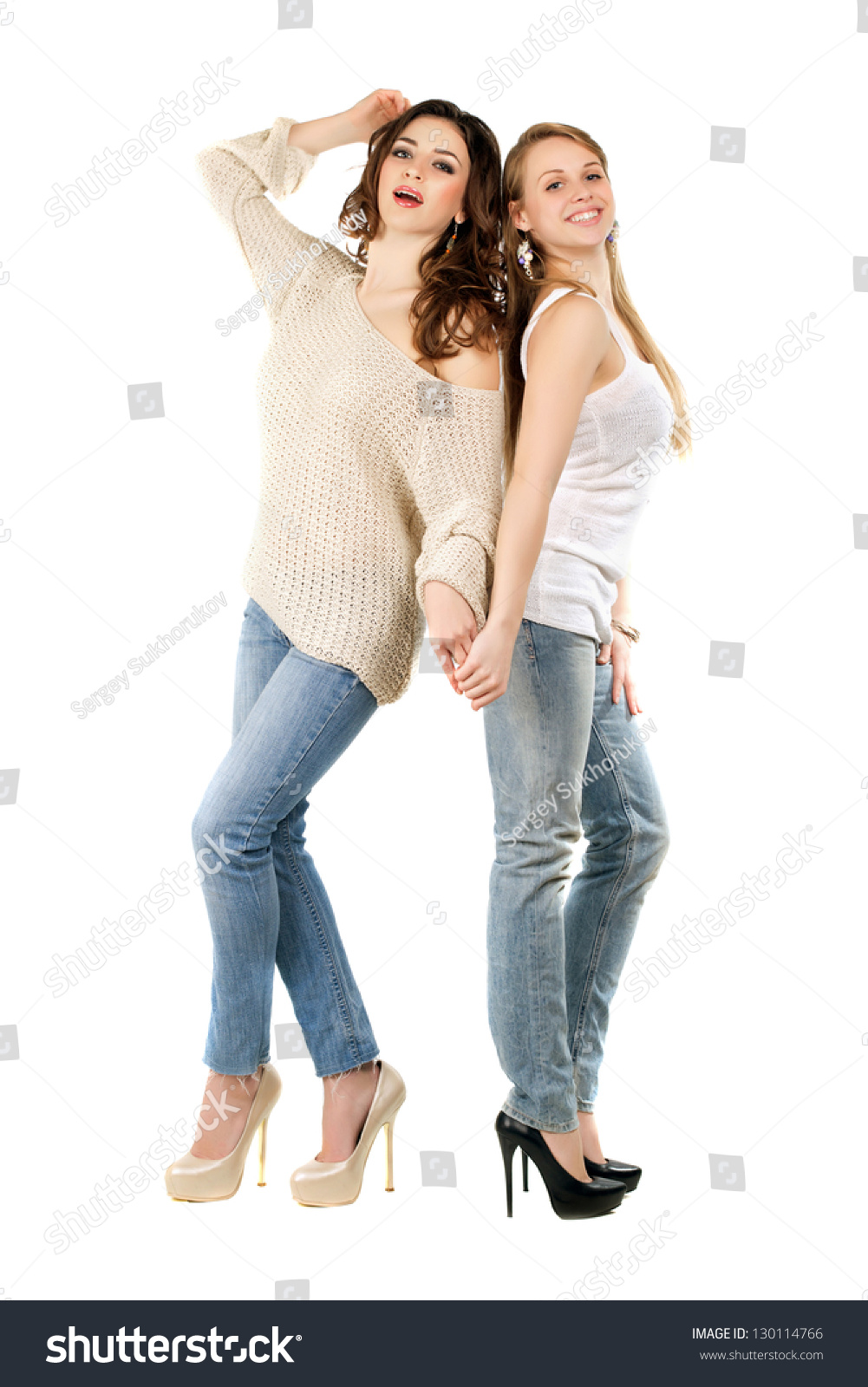 Attractive Caucasian Women Posing In Blue Jeans And High Heels ...
