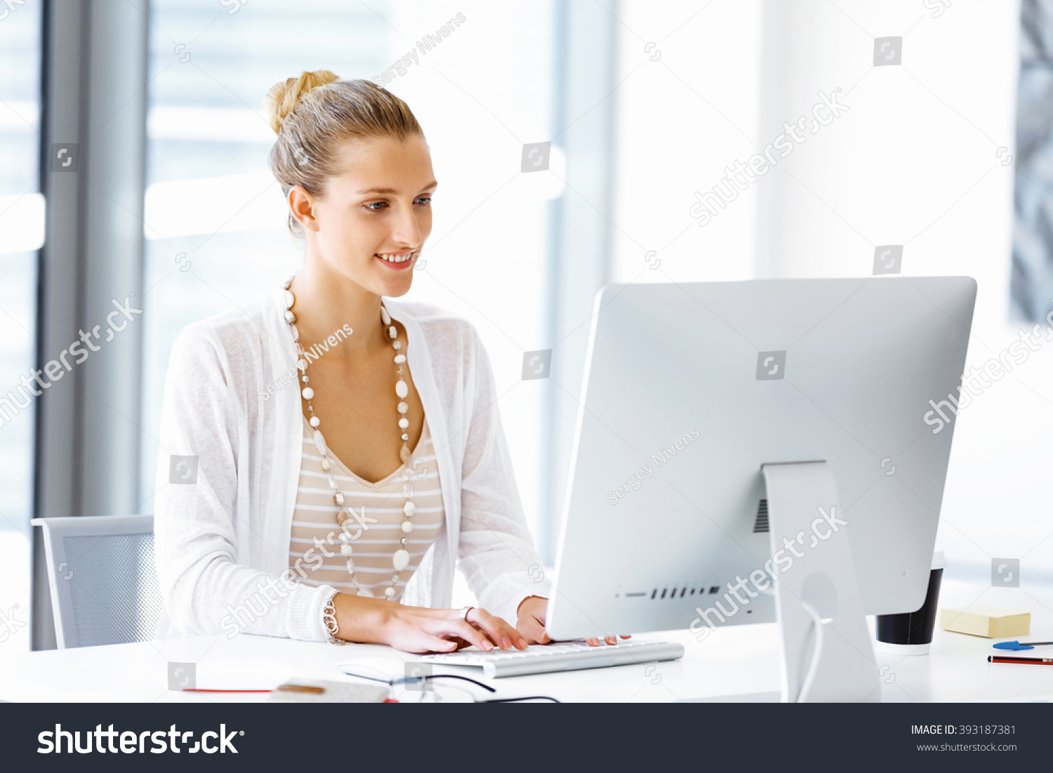 Attractive Office Worker Sitting At Desk Stock Photo 393187381 ...