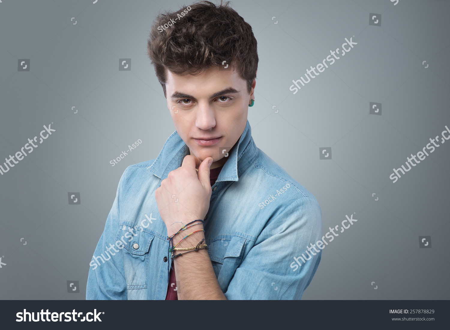 Attractive Smirking Boy Flirting With Hand On Chin Stock Photo ...