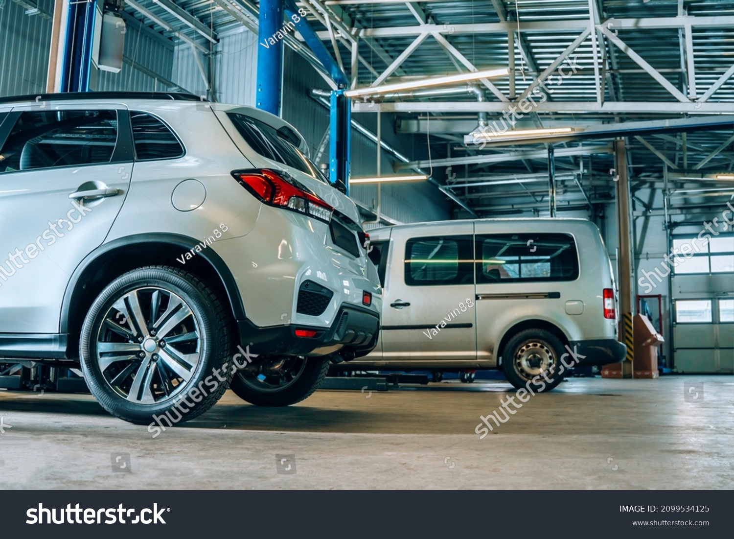 Auto Repair Shop Interior Cars Being Stock Photo 2099534125 Shutterstock   Stock Photo Auto Repair Shop Interior Cars Are Being Serviced 2099534125 