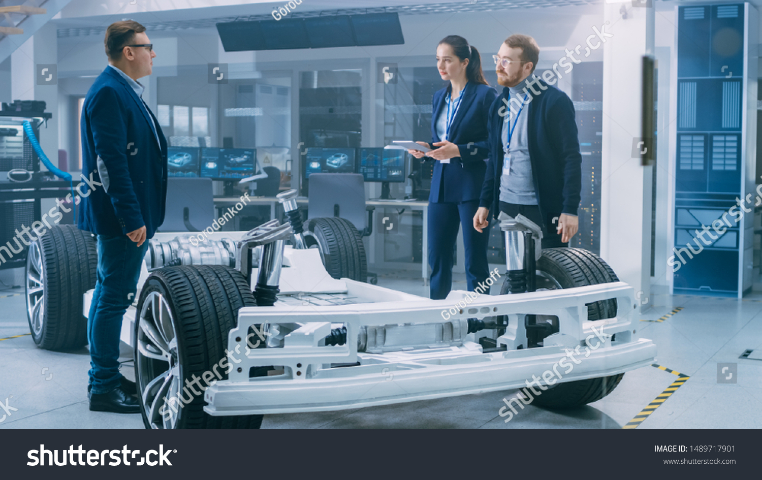 Automotive Design Engineers Talking While Working Stock Photo