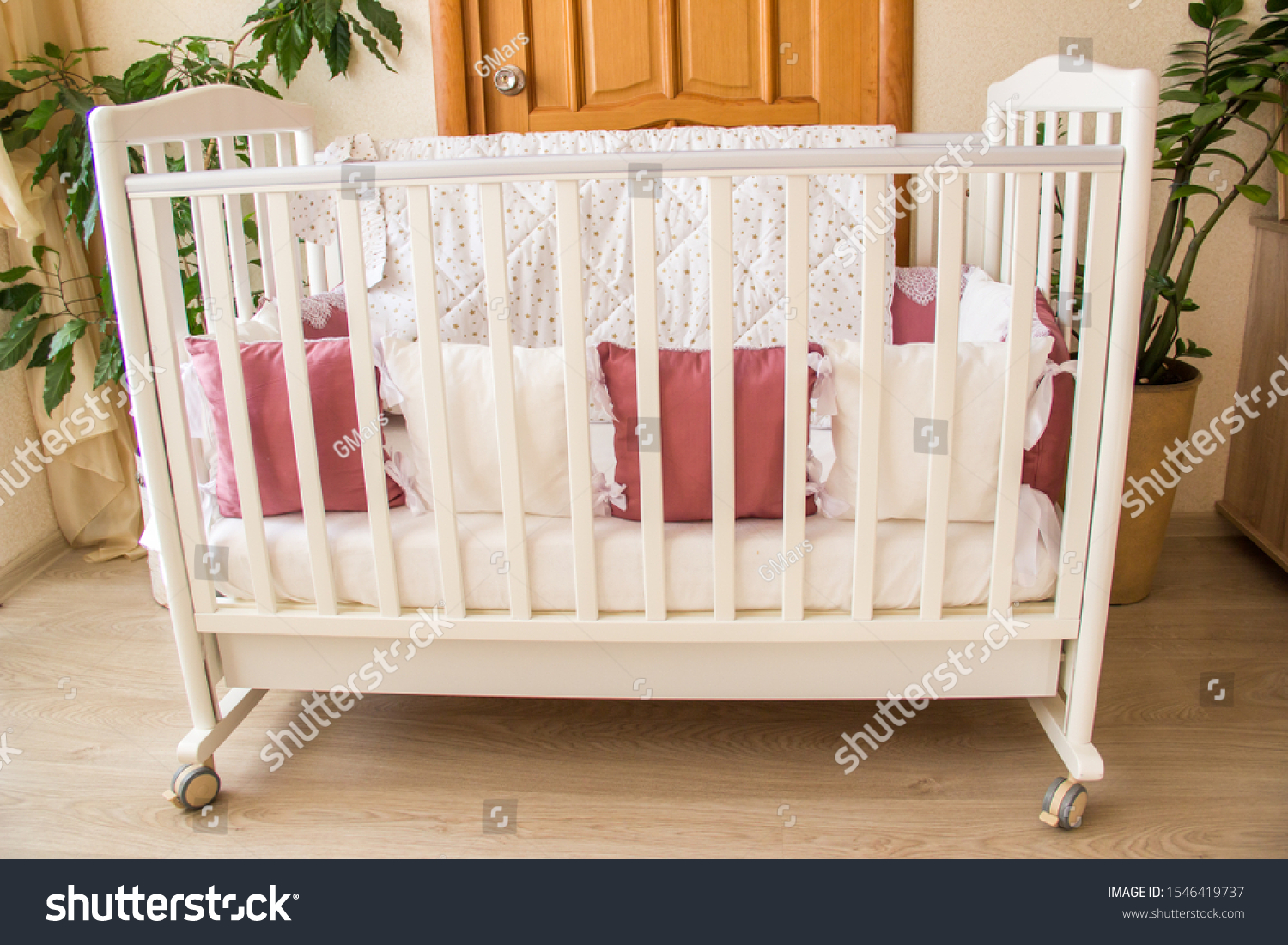 white and wood cot bed