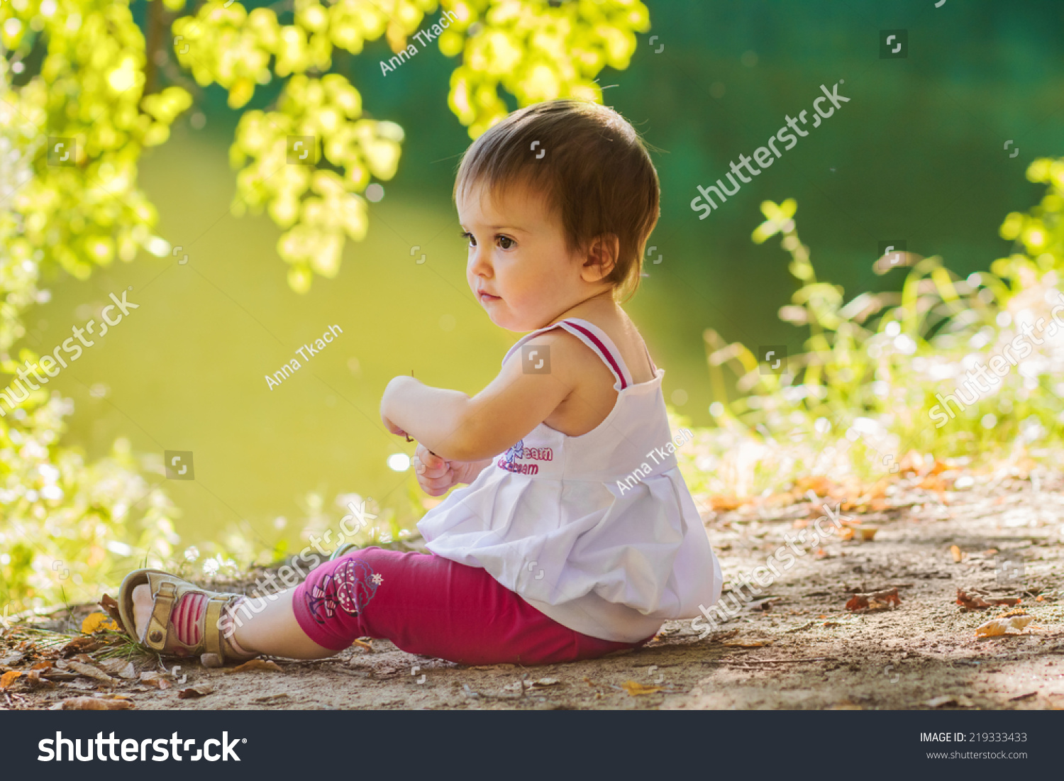 Baby Girl Sitting Alone On Shore Stock Photo 219333433 - Shutterstock