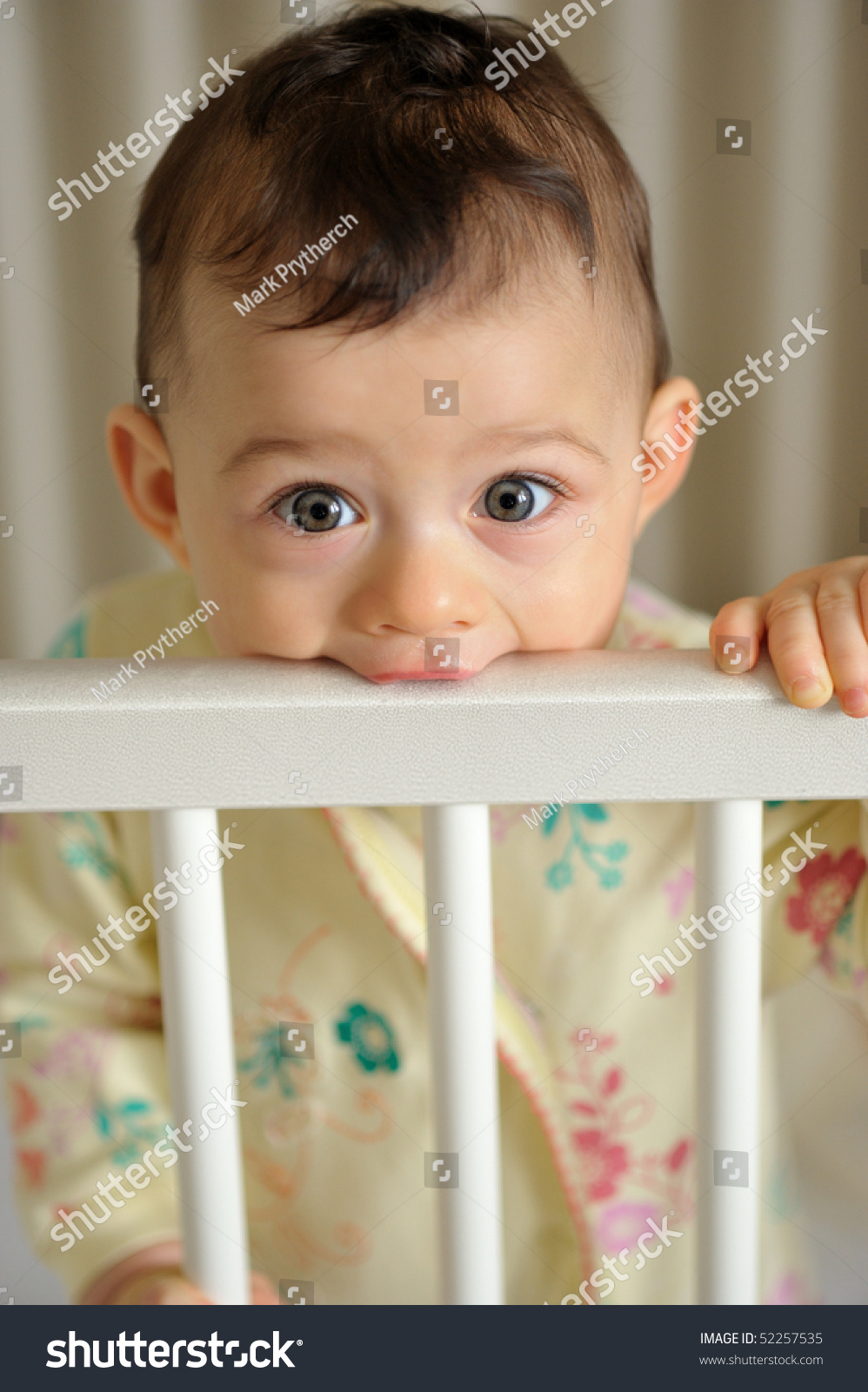 Baby Girl Teething On Crib Rails Stock Photo Edit Now 52257535