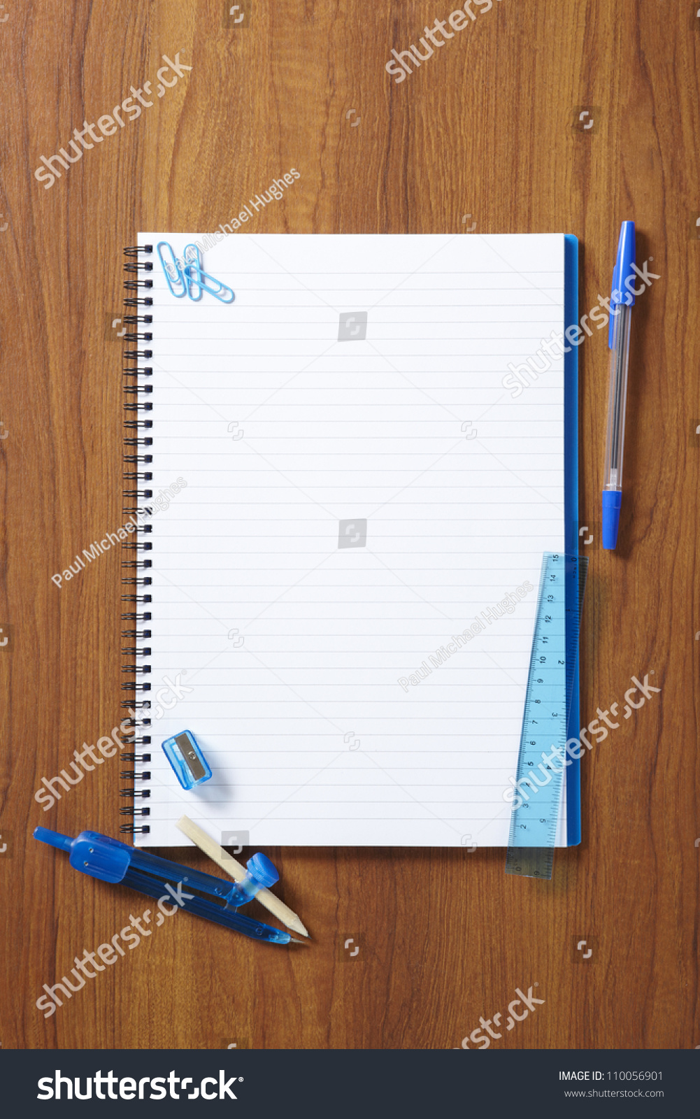 Back To School Pupils Note Pad And Stationary On Wooden School Desk ...